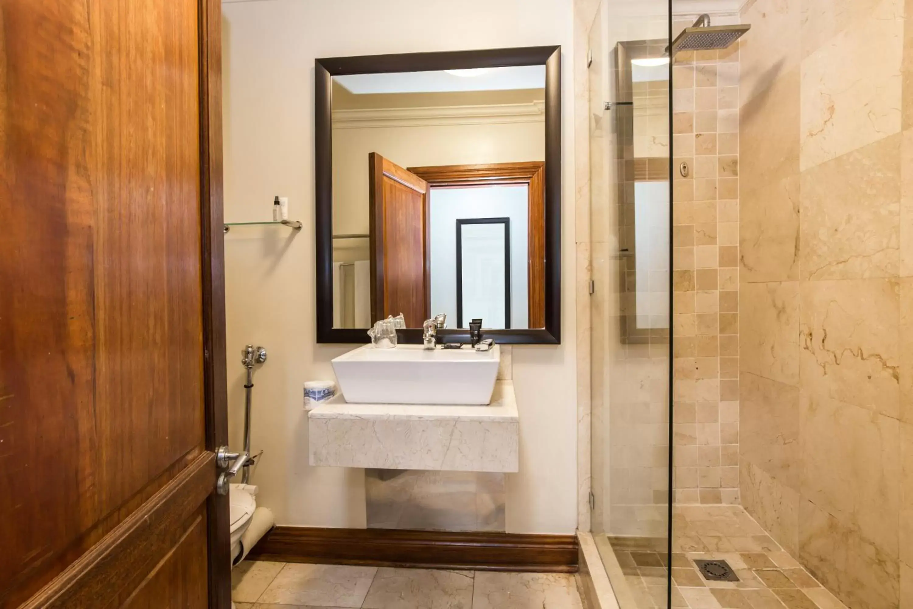 Bathroom in Belaire Suites Hotel