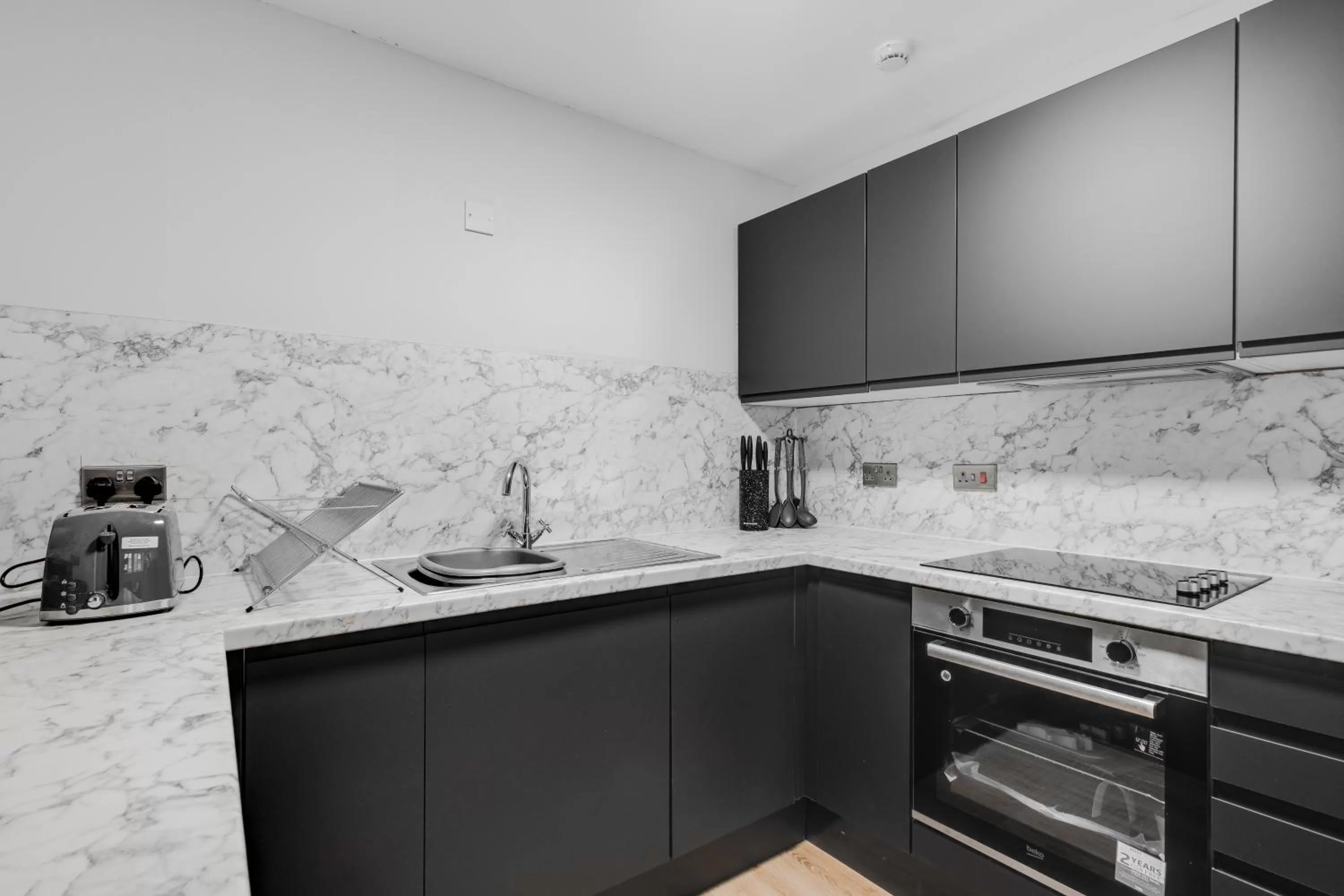 Kitchen or kitchenette in Stanley St Suites By GuestFirst