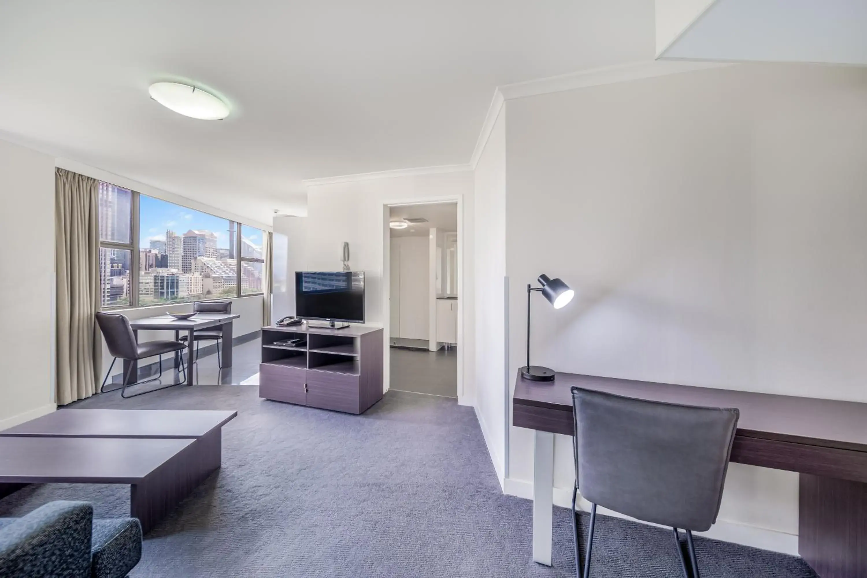 Communal lounge/ TV room, Seating Area in Oaks Sydney Hyde Park Suites