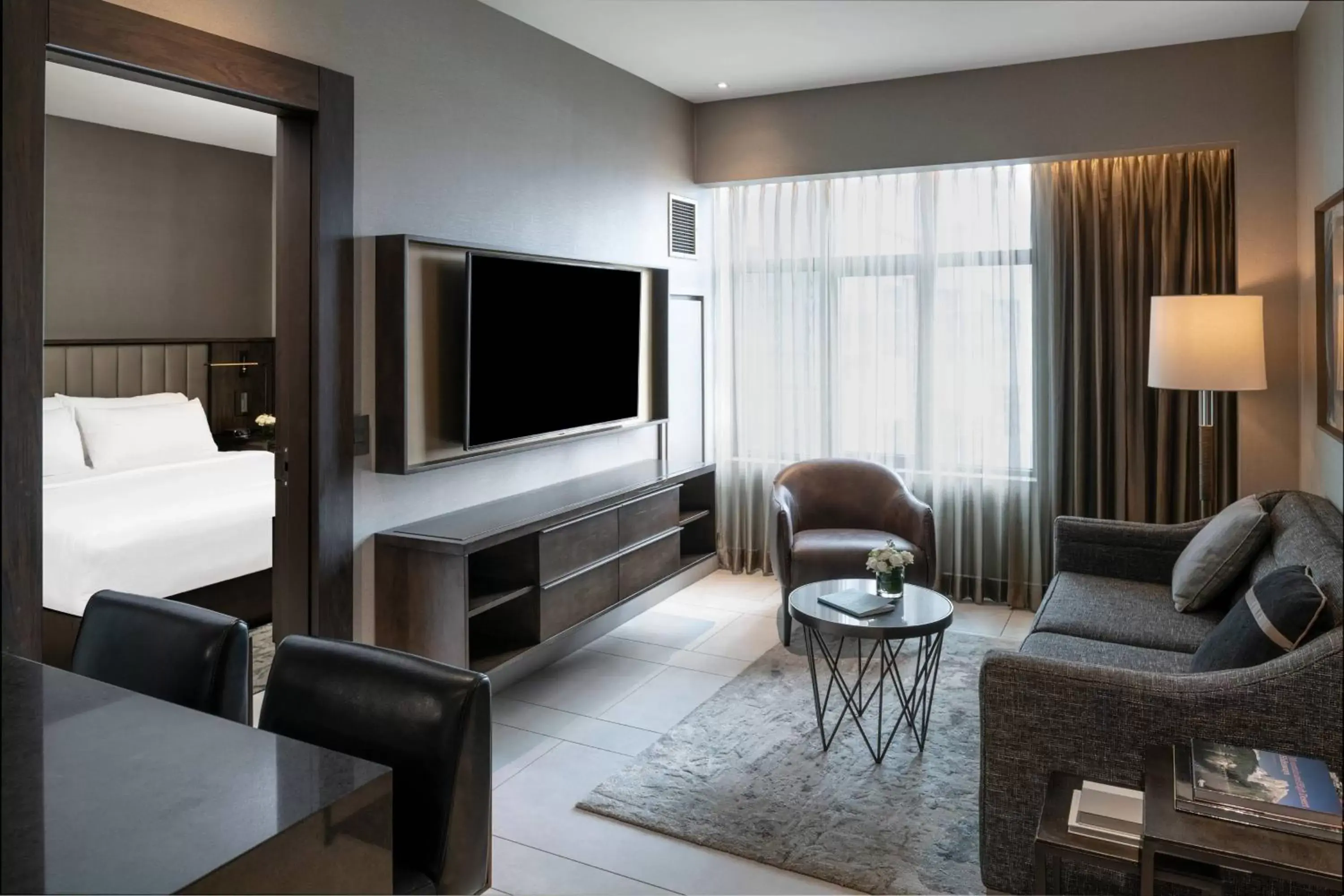 Living room, TV/Entertainment Center in The Row Hotel at Assembly Row, Autograph Collection by Marriott