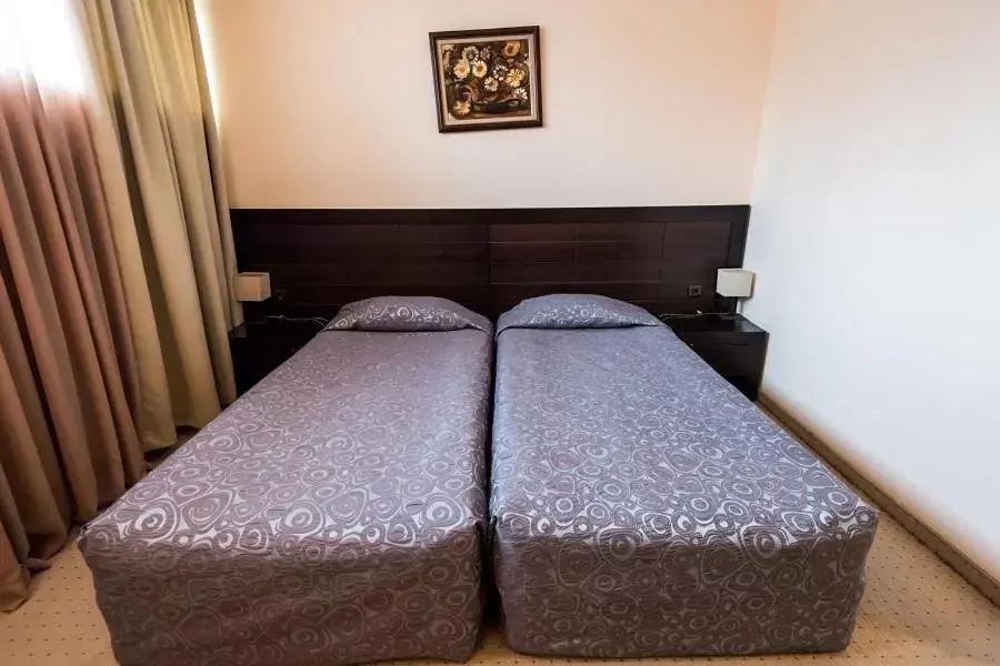 Bed in Gardenia Park Hotel