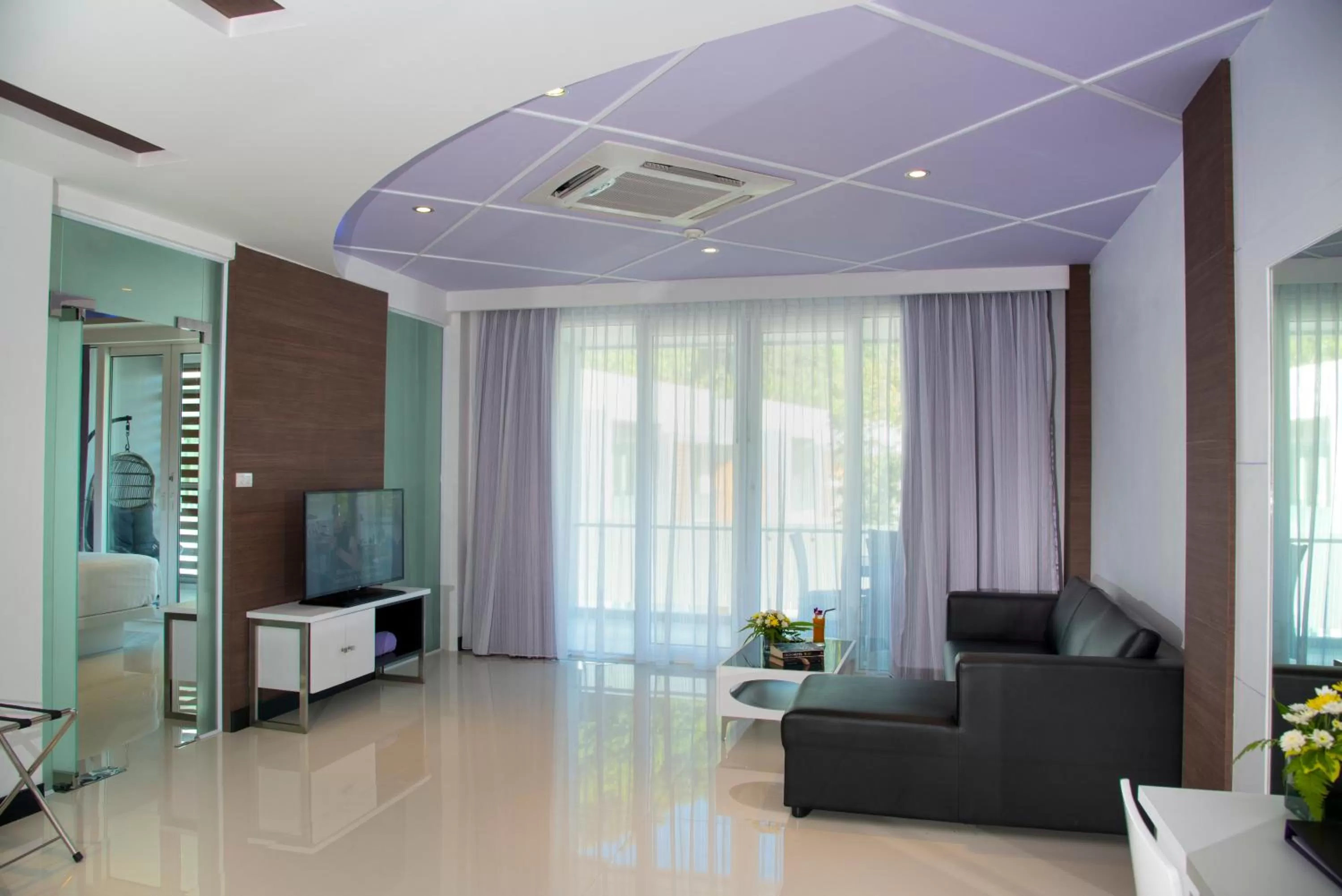 Communal lounge/ TV room in The L Resort, Krabi