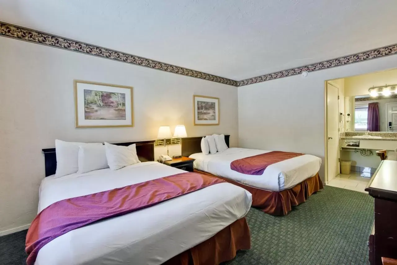 Bed in Americas Best Value Inn - Sky Ranch