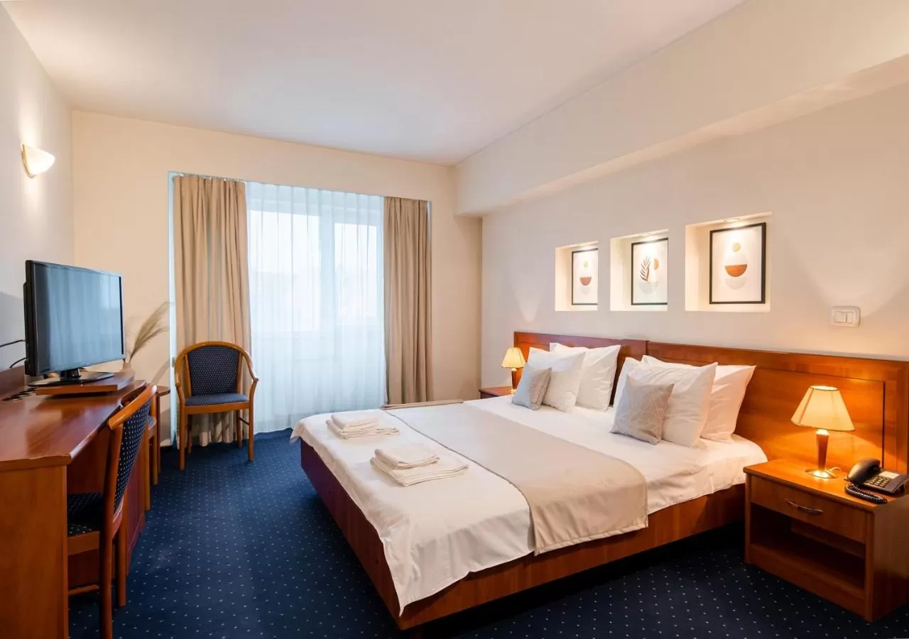 Bed in Hotel Excelsior By TimHotels