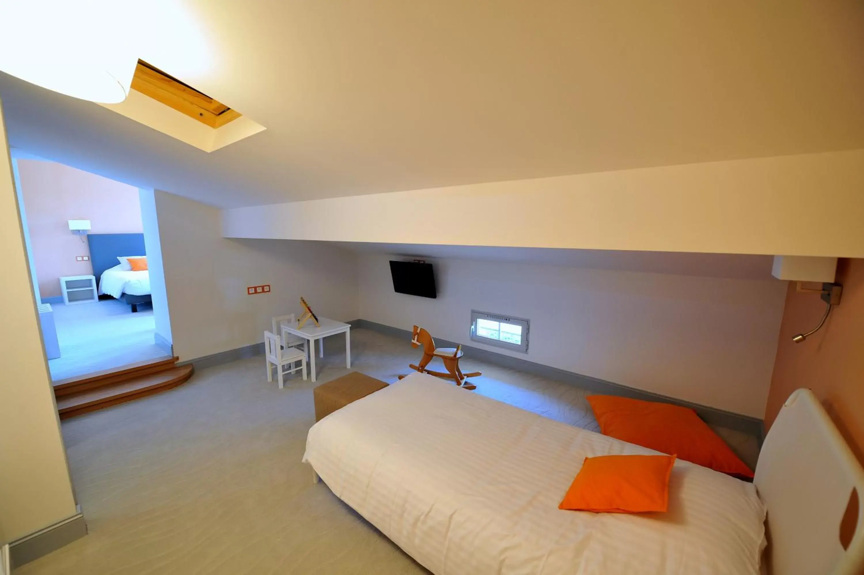 Bedroom in Logis- Hôtel Spa Restaurant l'Epicurial