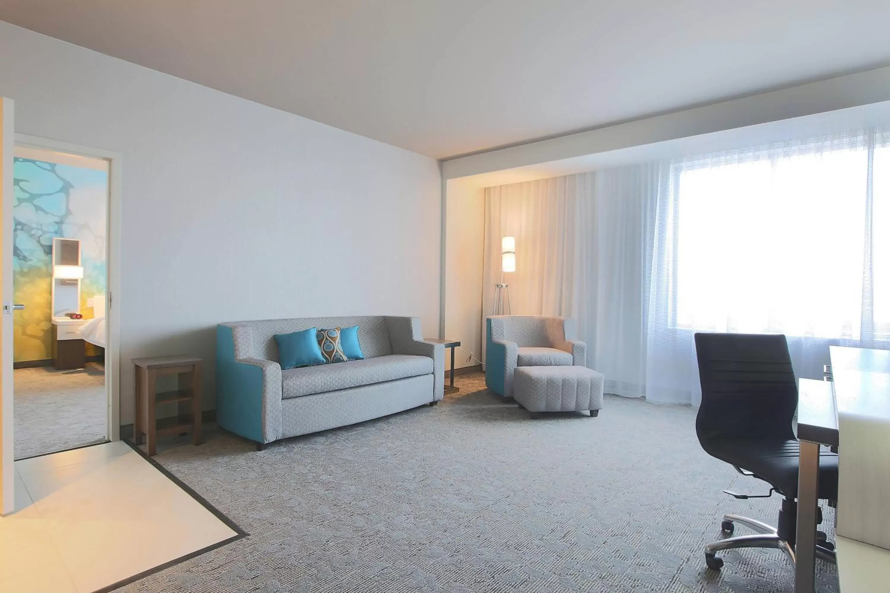 Living room, Seating Area in Courtyard by Marriott Montreal Brossard