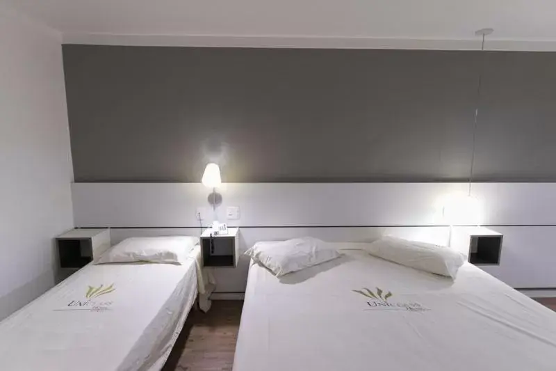 Bed in Uniclass Hotel Pinheiros