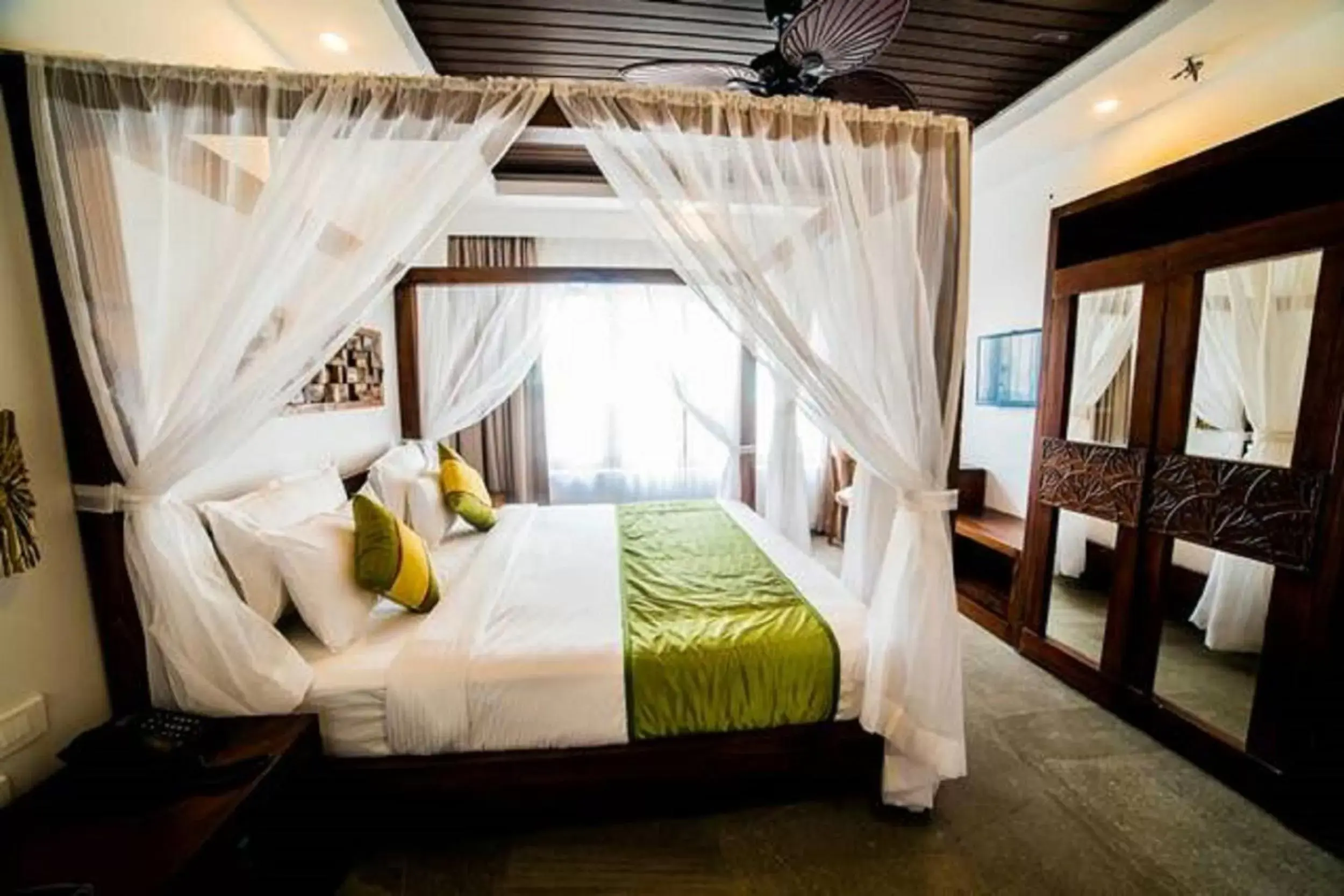 Bed in Elixir Hills Suites Resort and Spa
