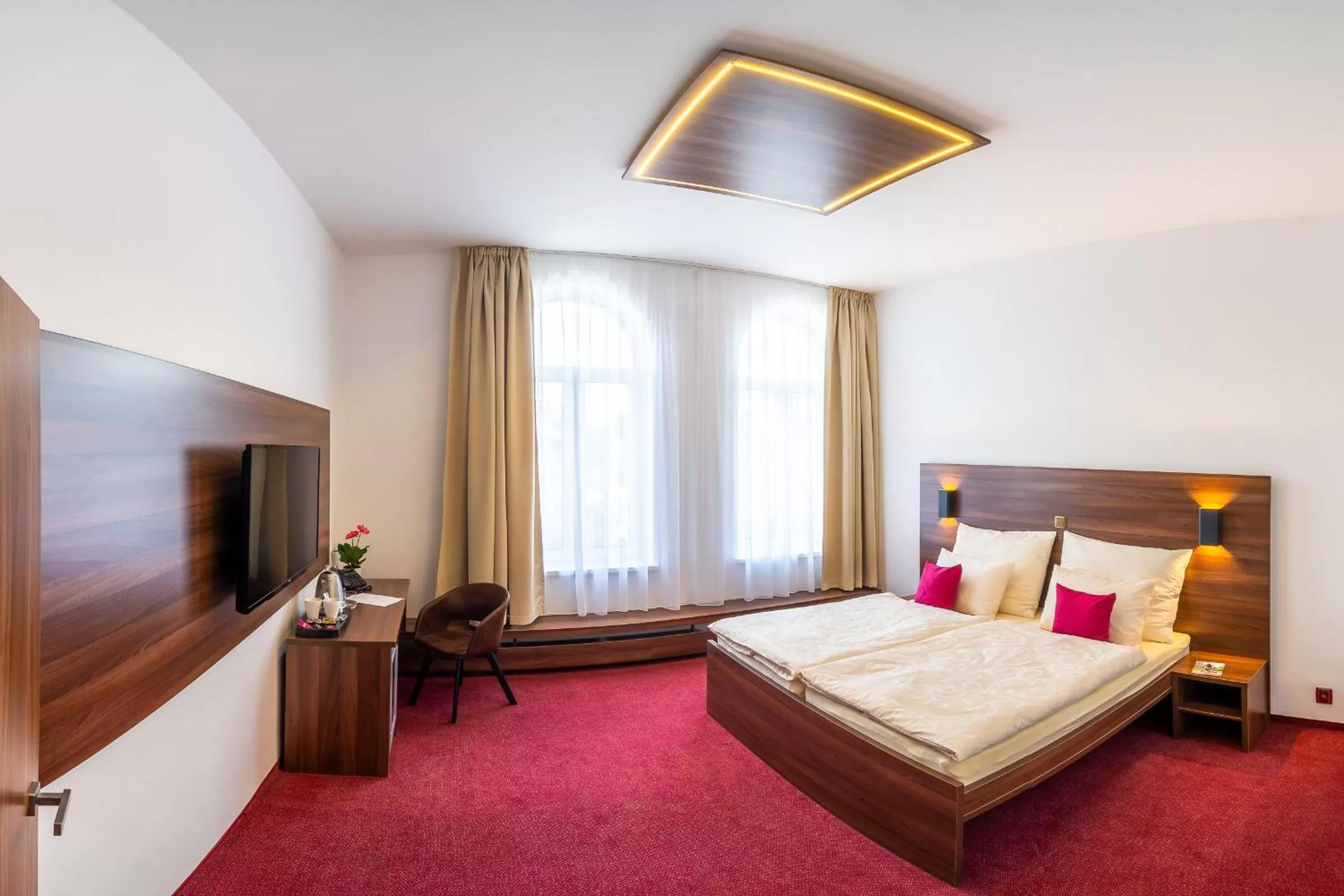 Bed in Bohemia Inn Hotel