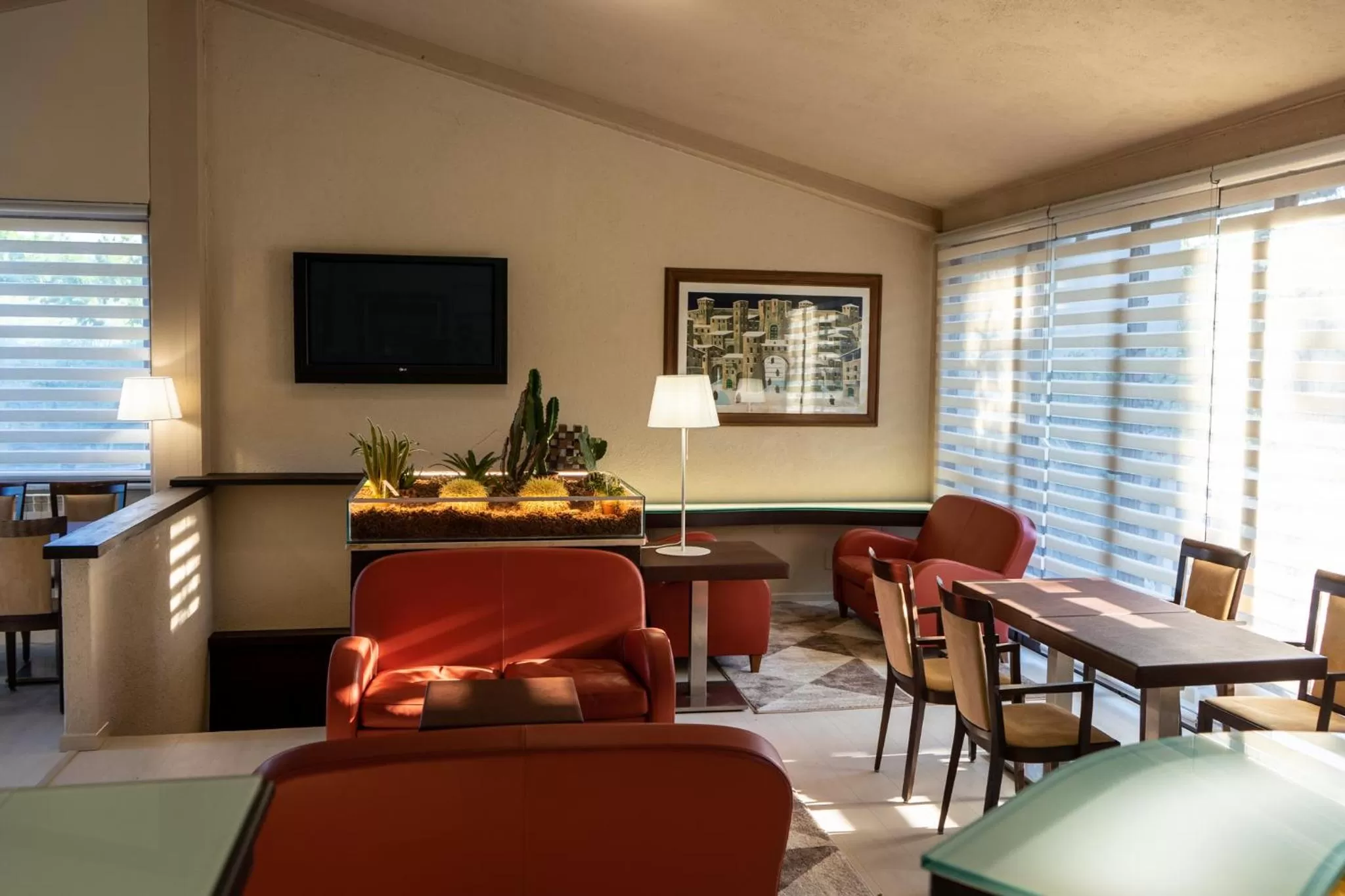 Communal lounge/ TV room in Hotel & Spa Villa dei Mosaici