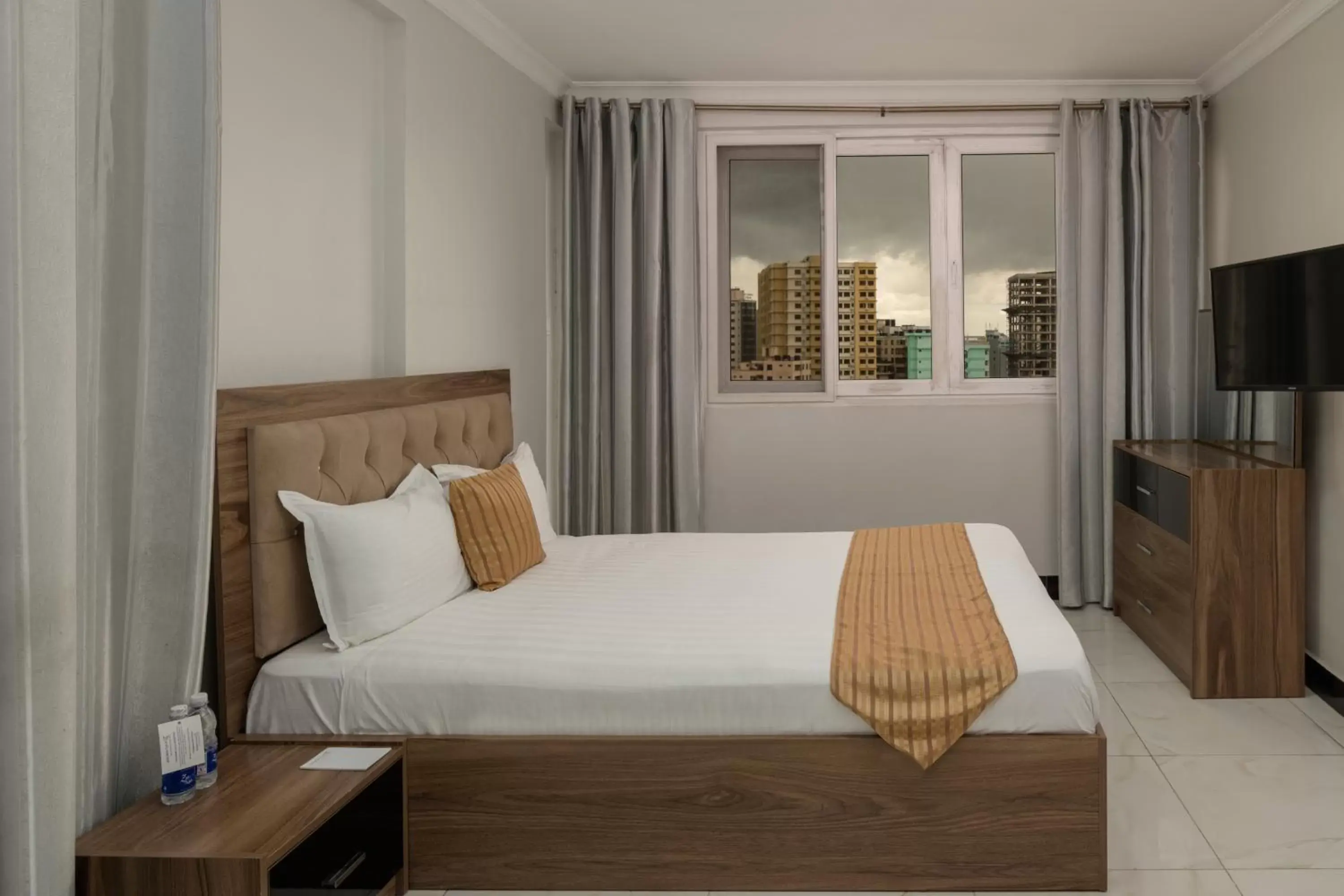 Bed, Room Photo in Golden Tulip Dar Es Salaam City Center Hotel