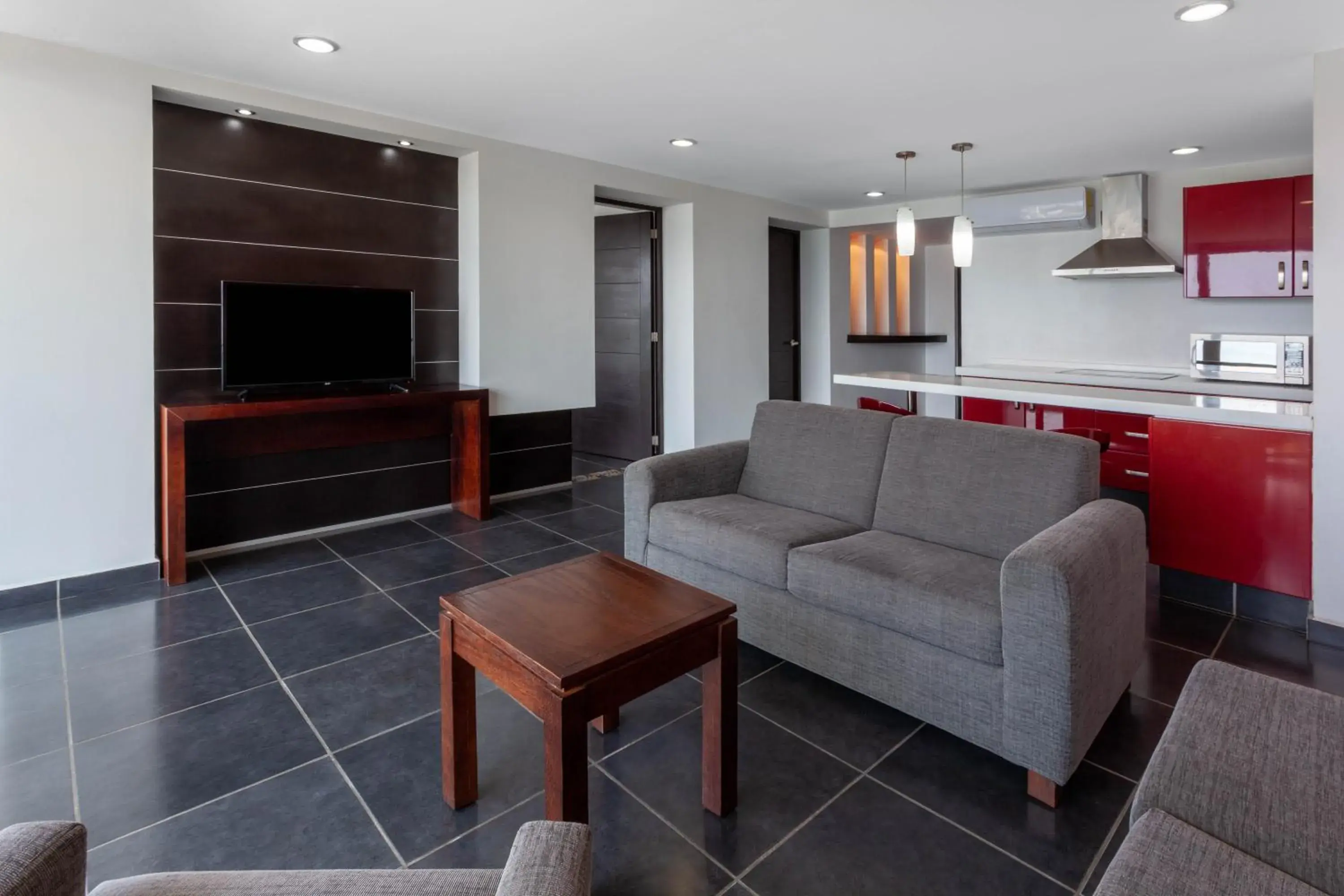 Living room, Seating Area in Ramada by Wyndham Acapulco Hotel & Suites