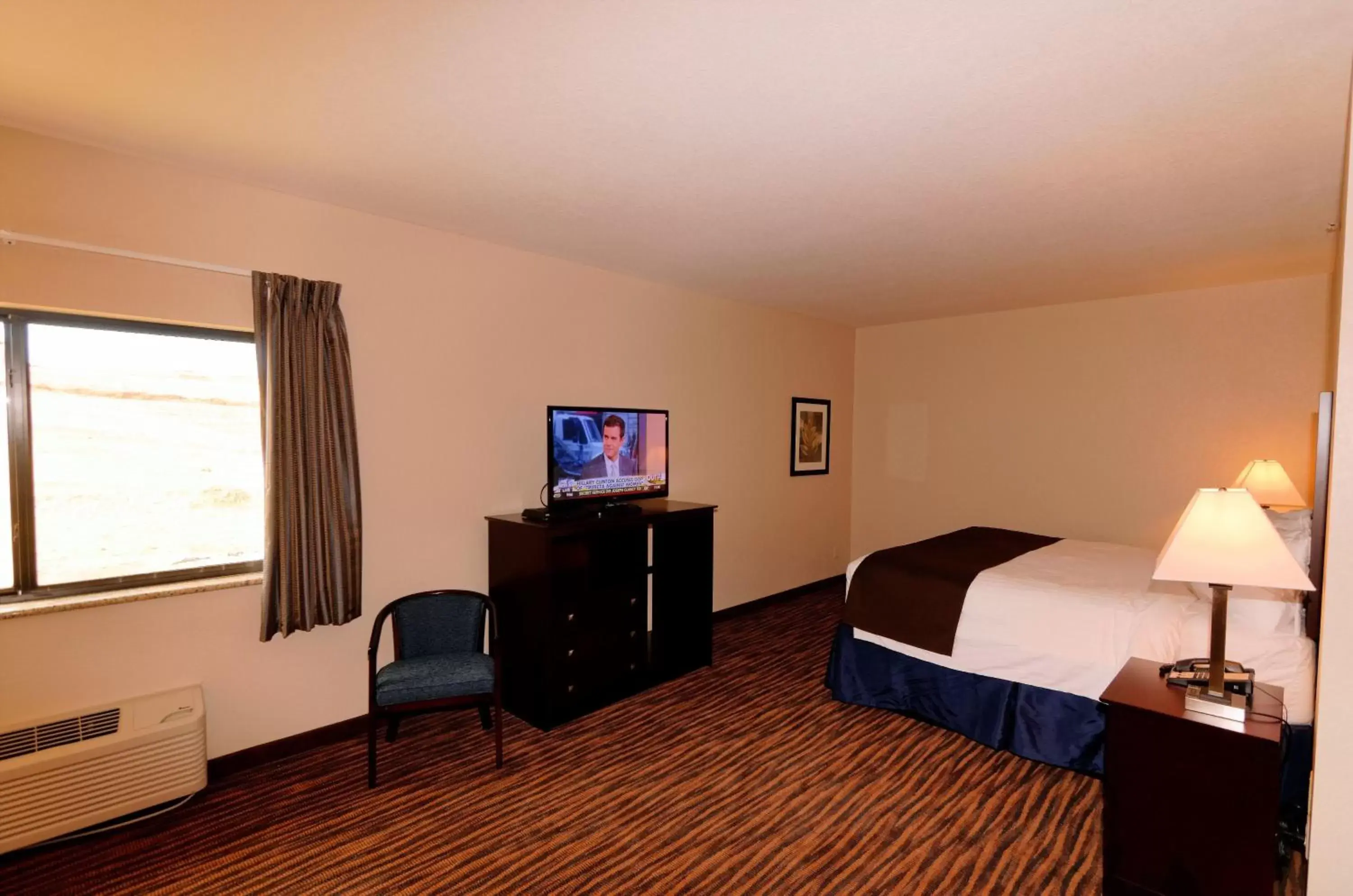Bed, TV/Entertainment Center in Cobblestone Inn & Suites - Denison | Oak Ridge