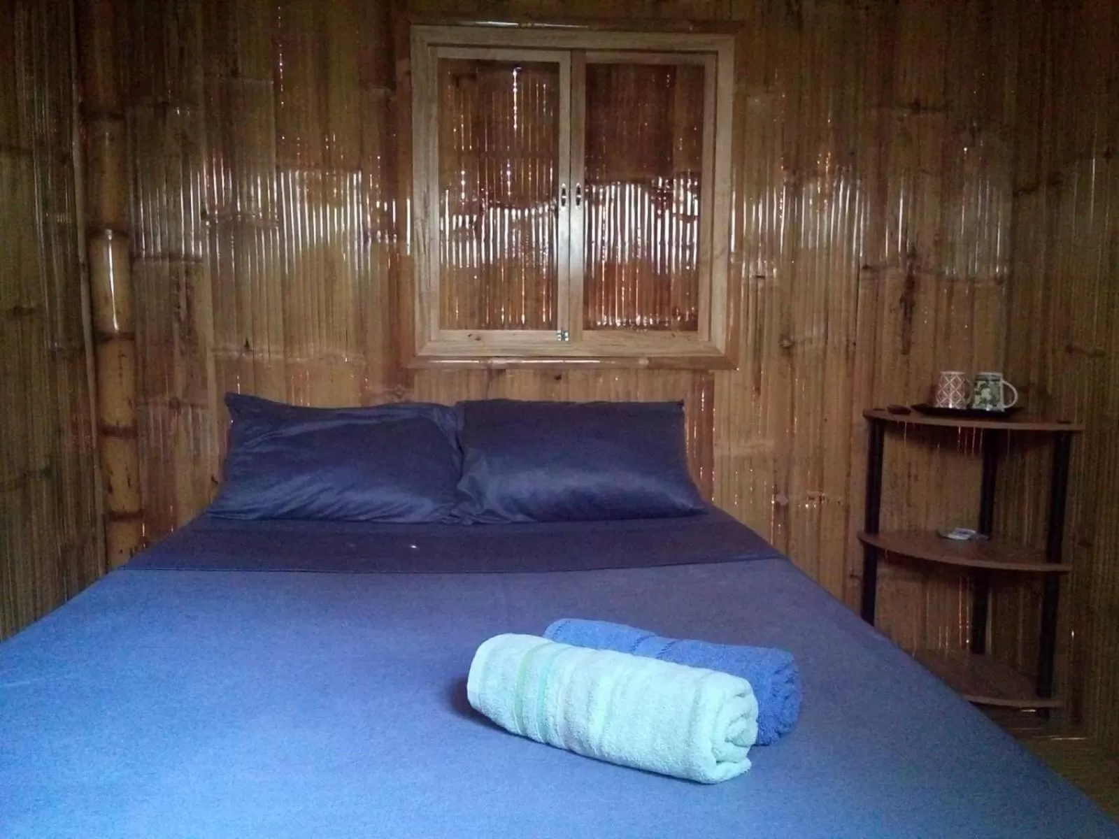 Bed in AivyMaes Divers Resort