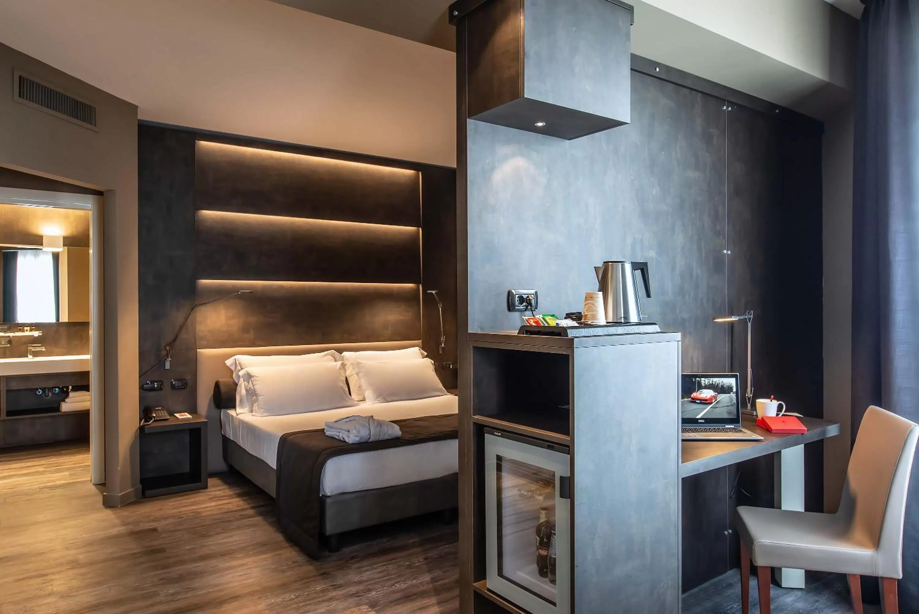 Photo of the whole room, Bed in Maranello Palace