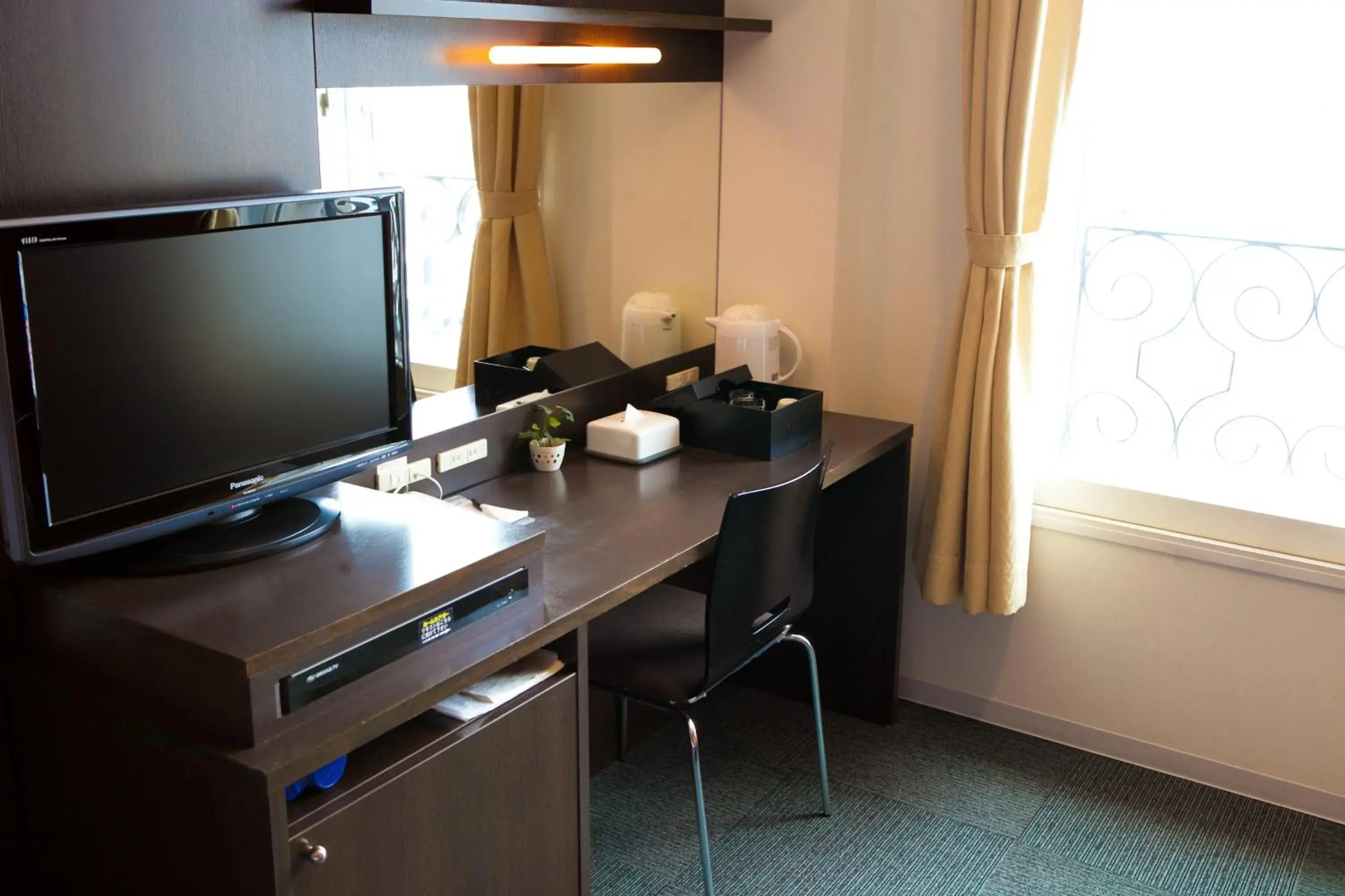 TV and multimedia, TV/Entertainment Center in Hotel Aile