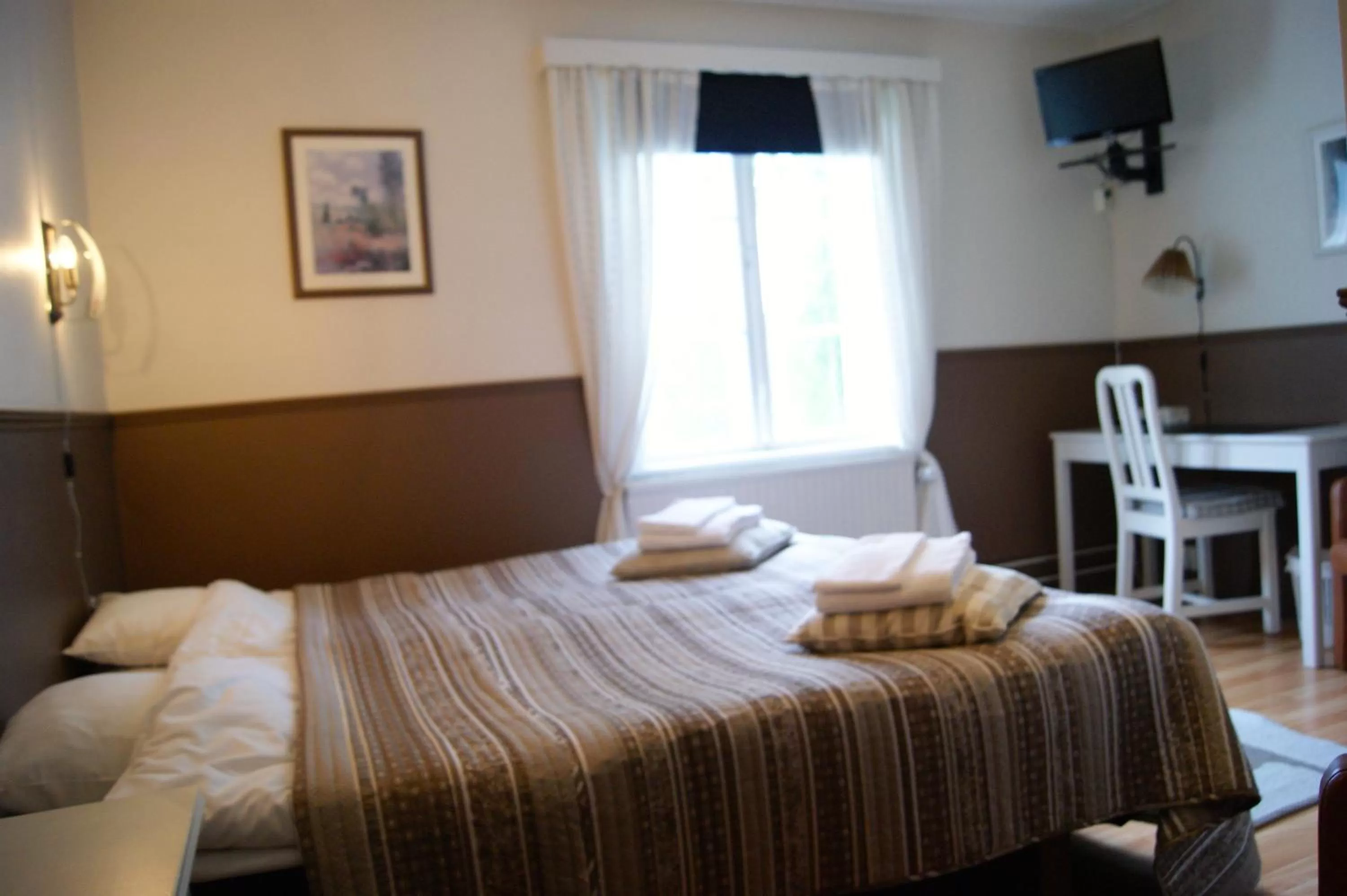 Photo of the whole room, Bed in Värdshuset Lugnet