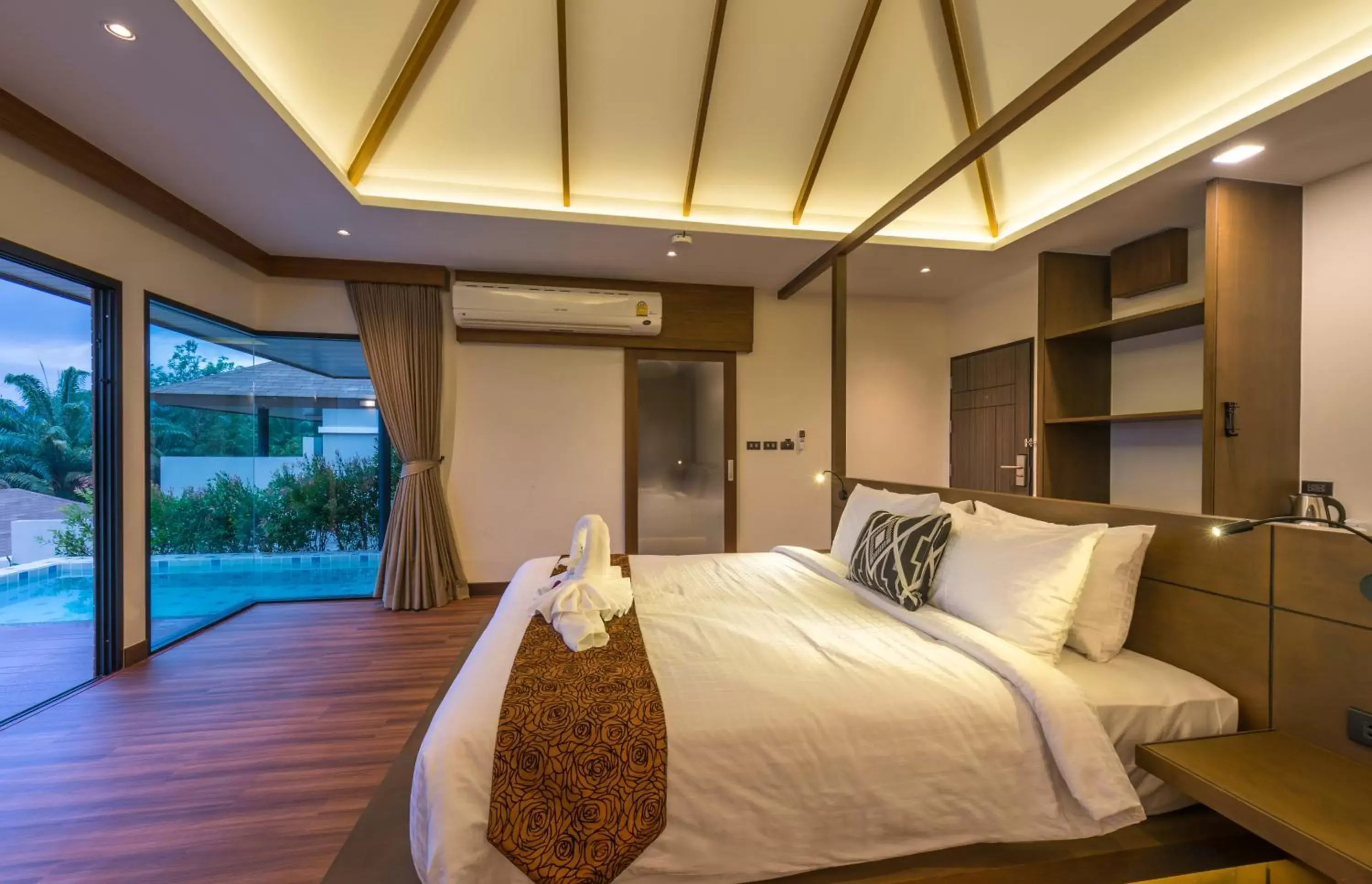 Bed in Cher​mantra​ Aonang​ Resort & Pool​ Suite