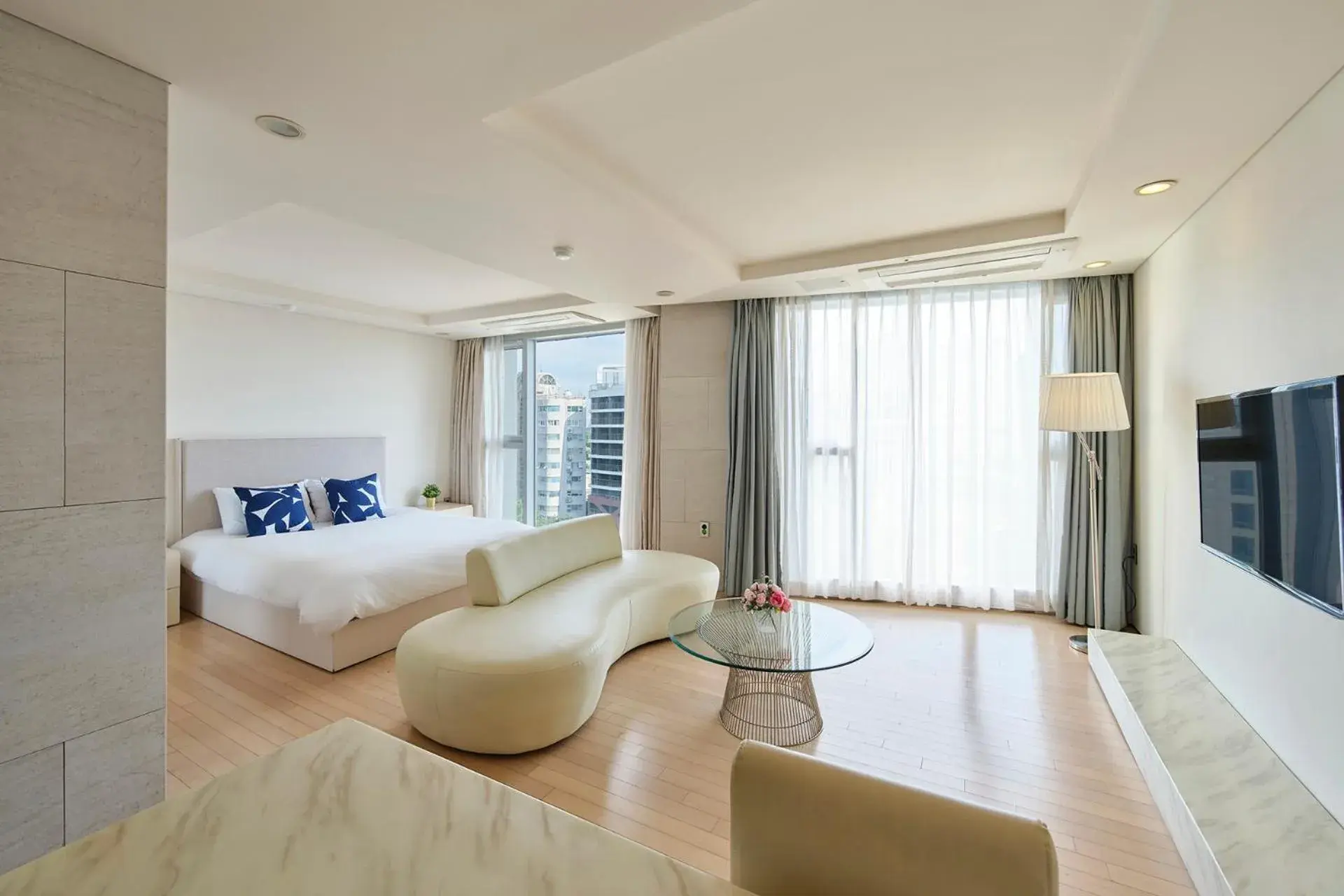 Bed, Seating Area in The Island Blue Hotel