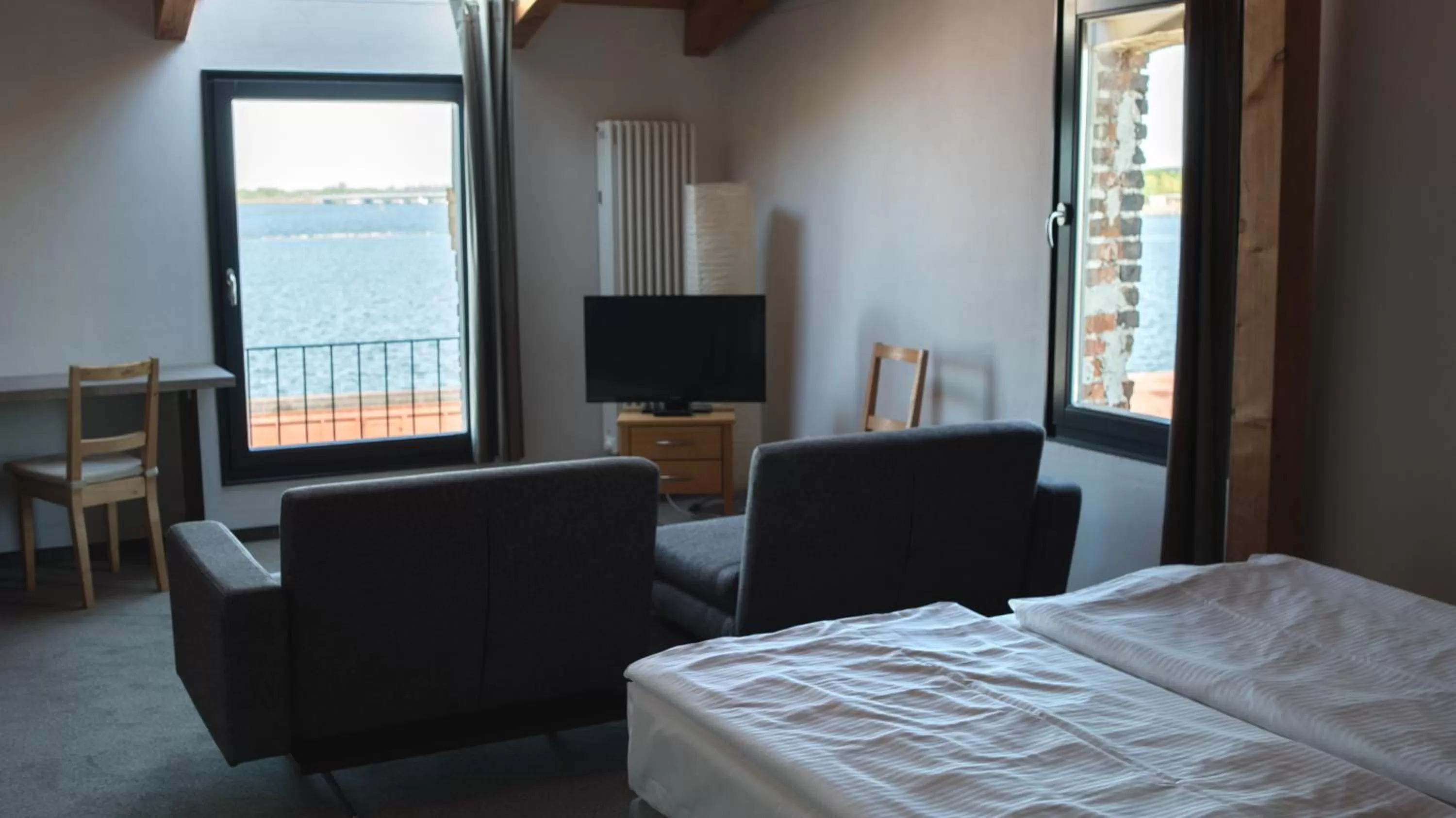 Seating area, Bed in Hotel Alter Hafenspeicher