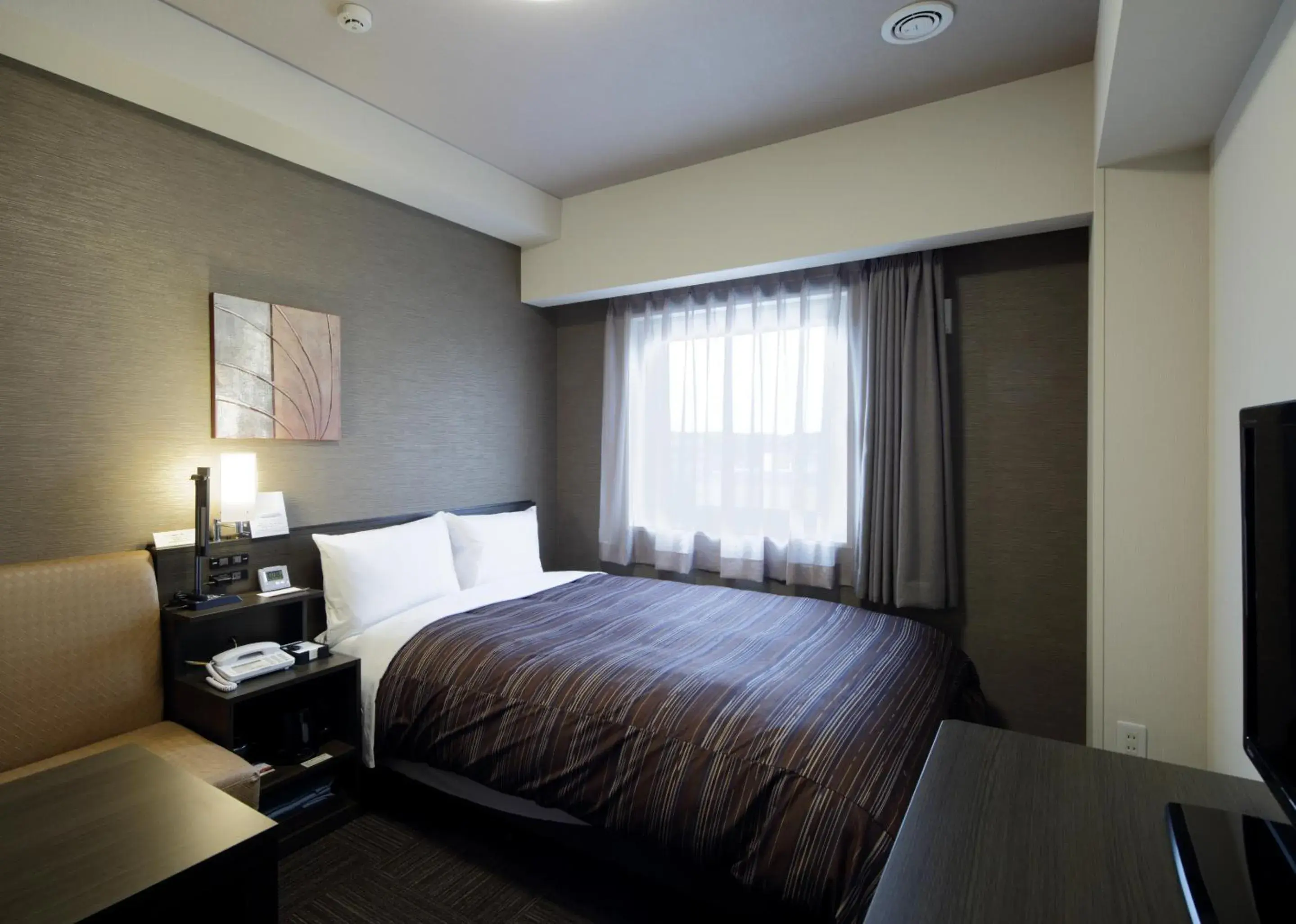 Bed in Hotel Route Inn Chiba Newtown Chuo Ekimae - Narita Airport Access Line