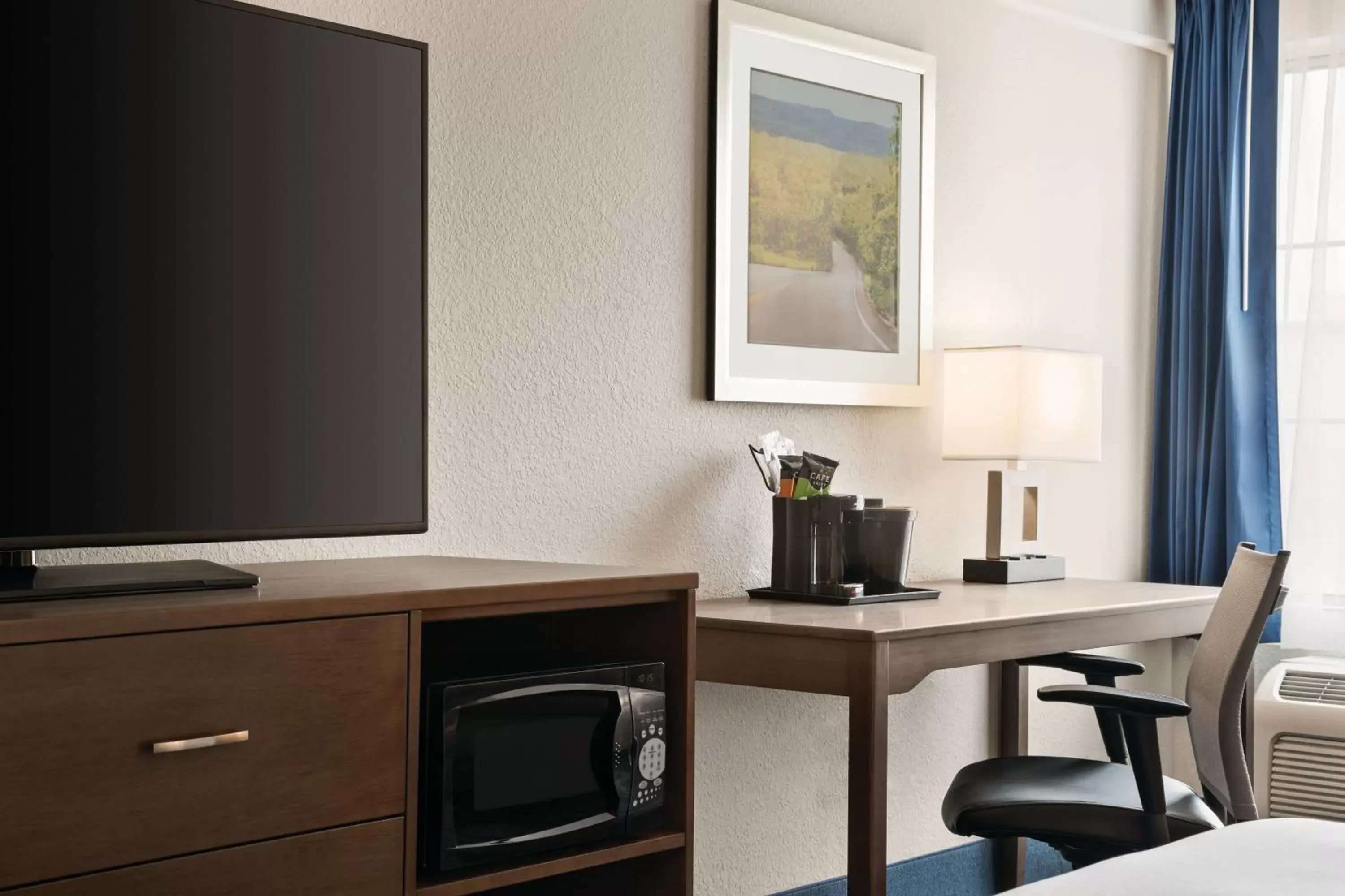 TV and multimedia, TV/Entertainment Center in La Quinta by Wyndham Rapid City