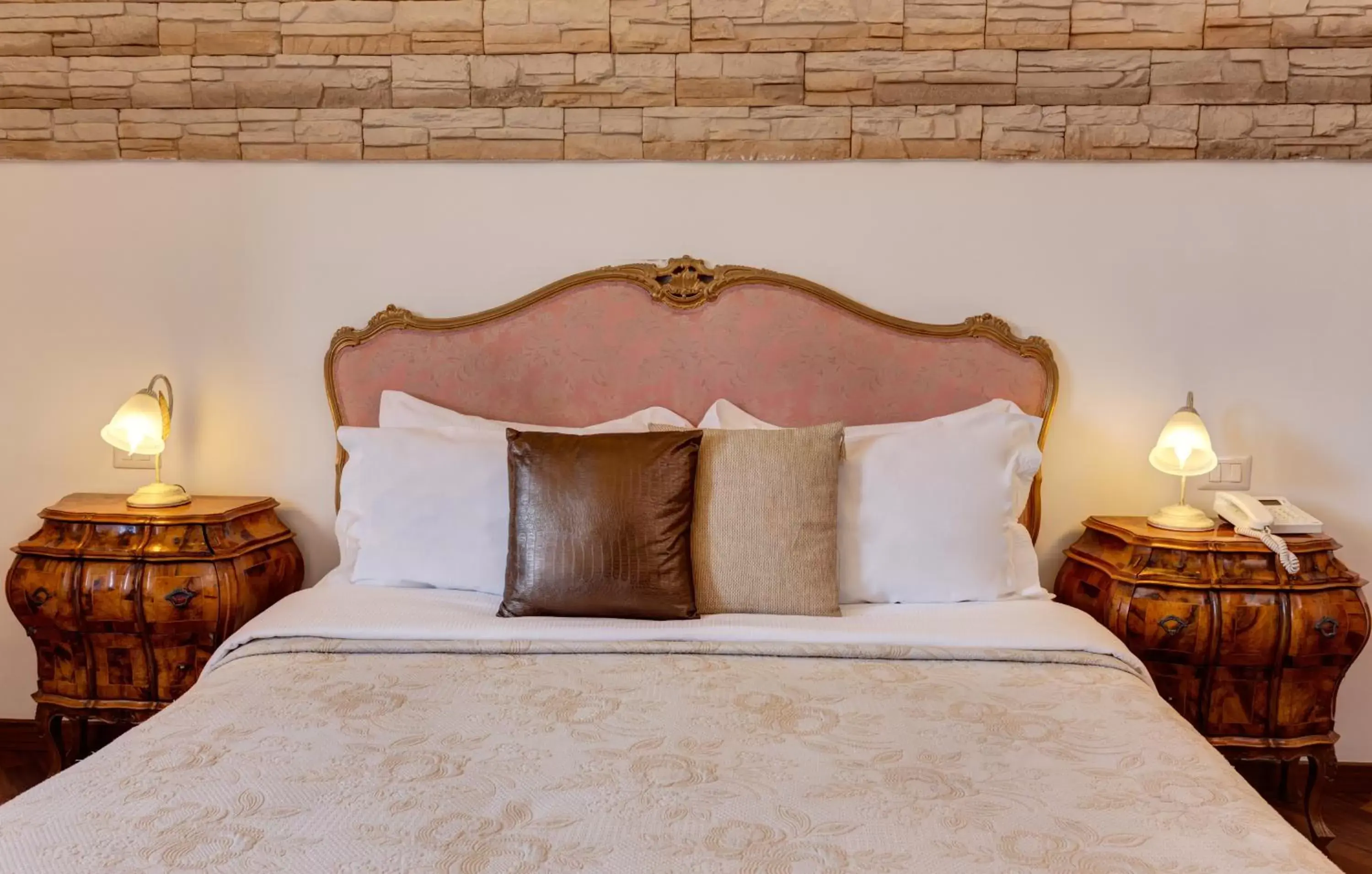 Decorative detail, Bed in Little Rhome Suites