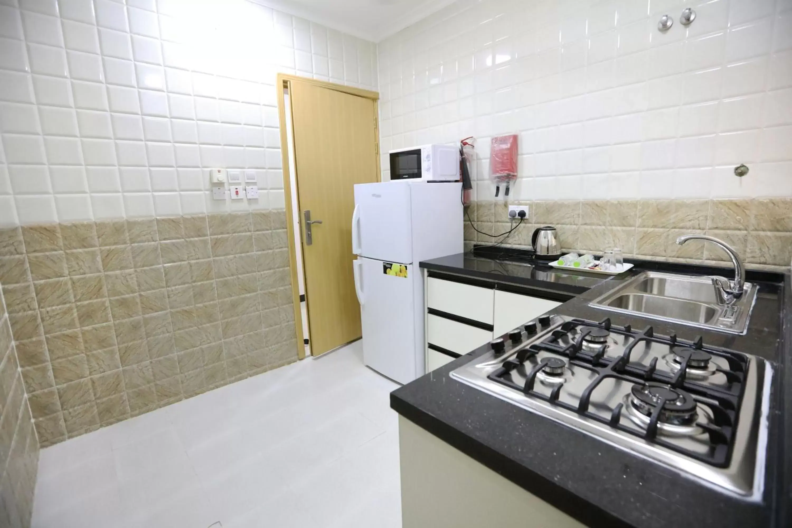 Kitchen or kitchenette in Al Rayyan Hotel Apartments Muscat Kitchen or kitchenette in Al Rayyan Hotel Apartments Muscat