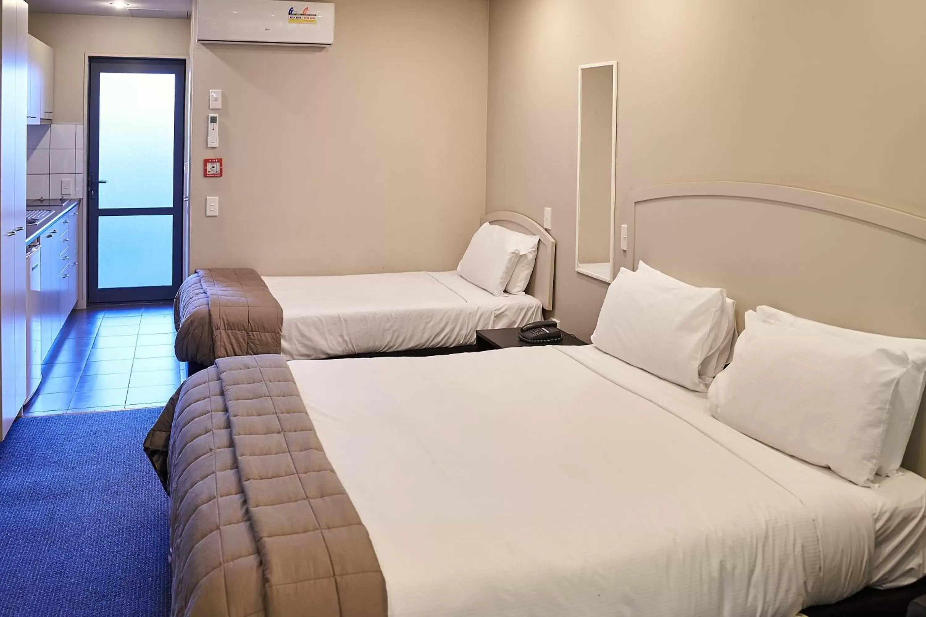 Bed in Azena Suites & Apartment