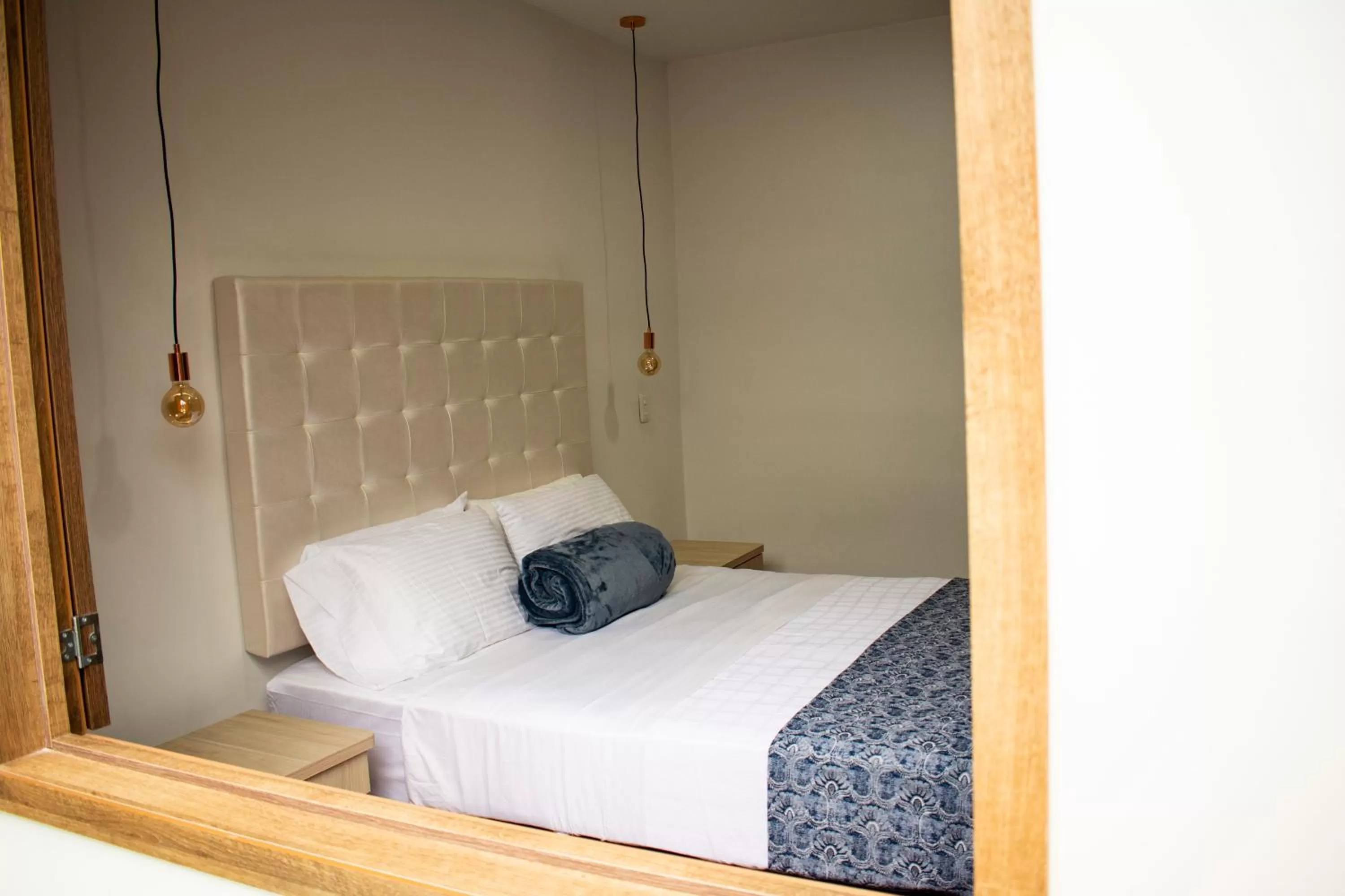 Bed in El Reloj Casa Hotel