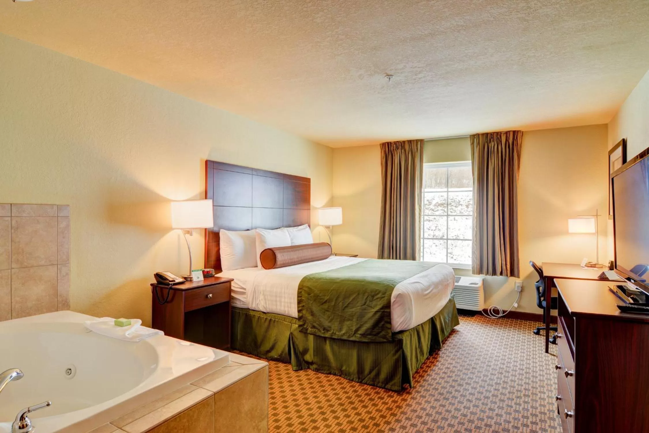 Bedroom in Cobblestone Hotel & Suites - Punxsutawney