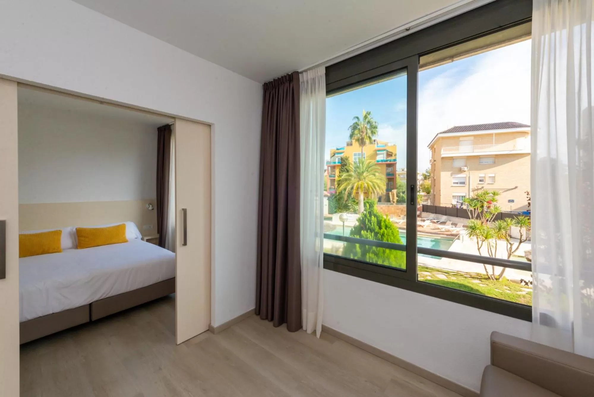Pool view, Bed in Atenea Park Suites & Apartments