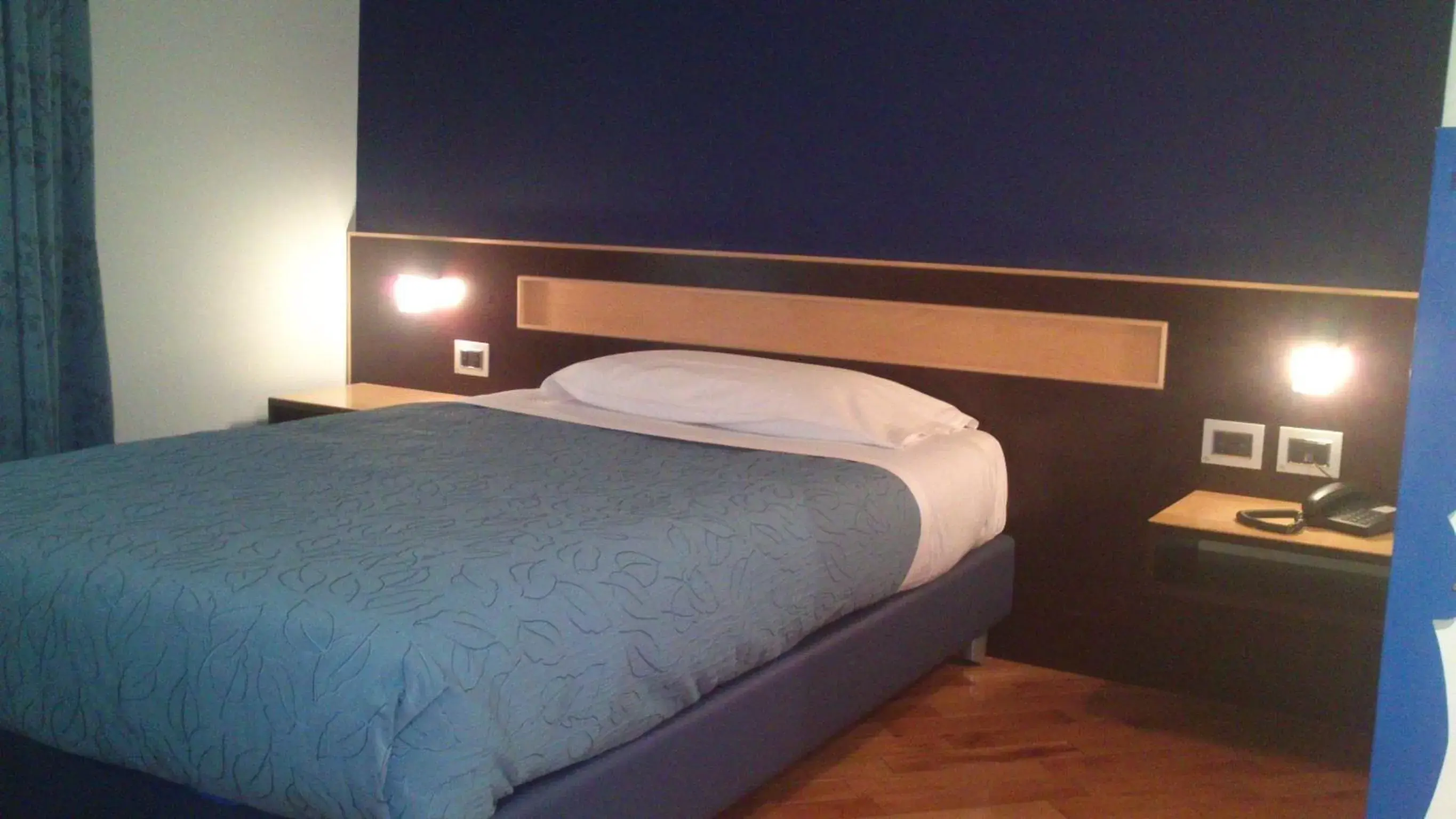 Bed in Rigel Hotel