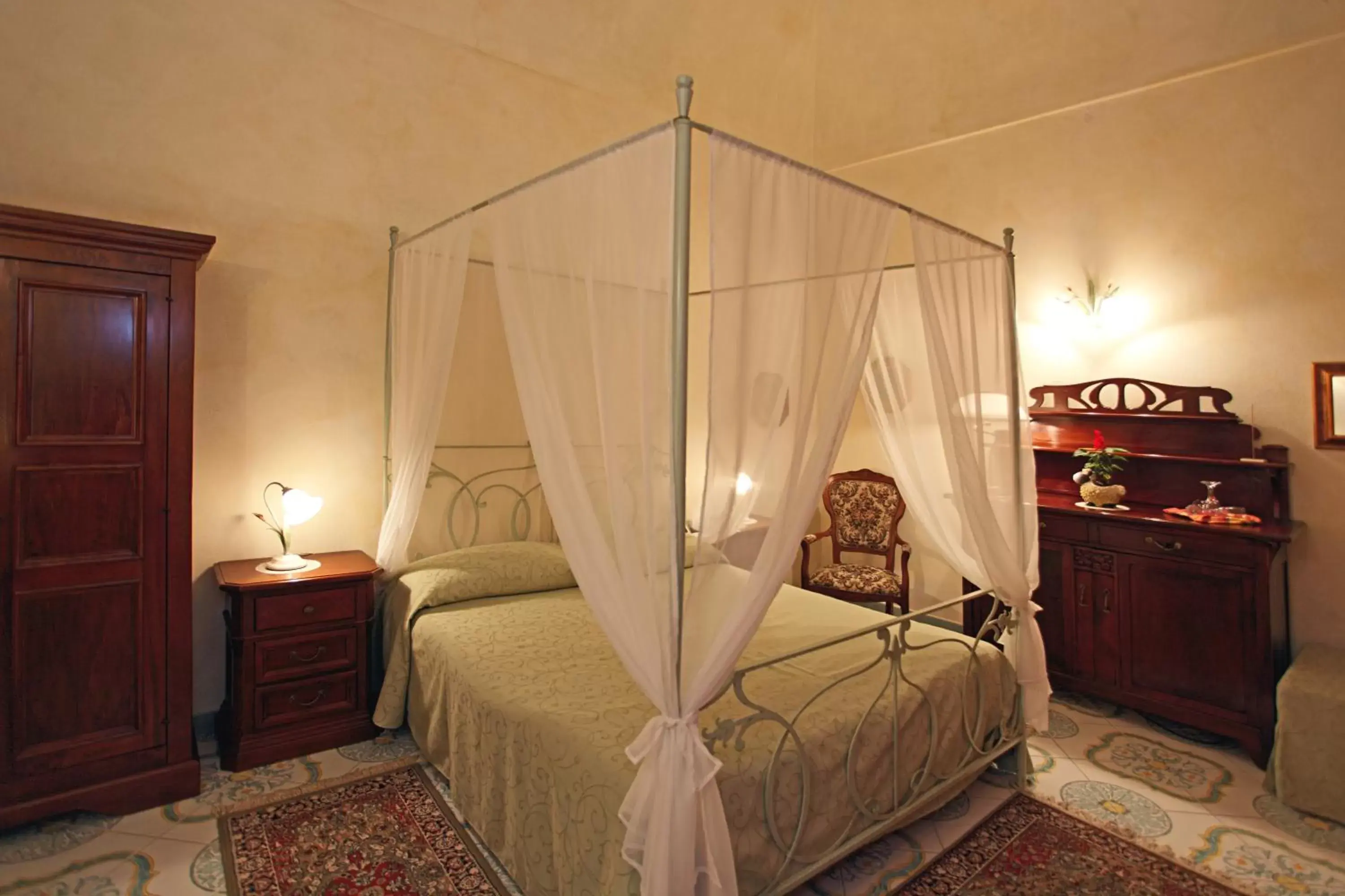 Photo of the whole room, Bed in L'Antico Borgo Dei Limoni