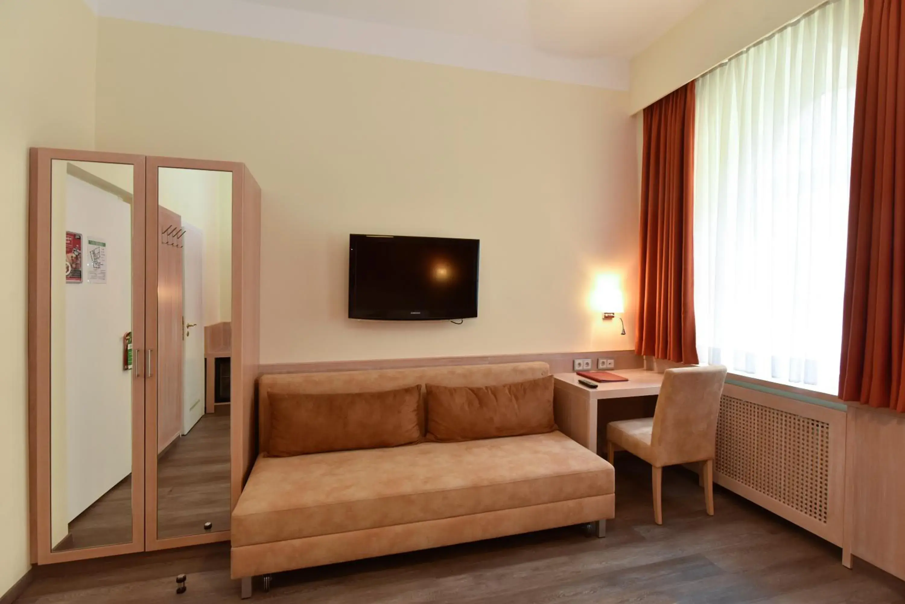 Photo of the whole room, TV/Entertainment Center in Hotel ADRIA München