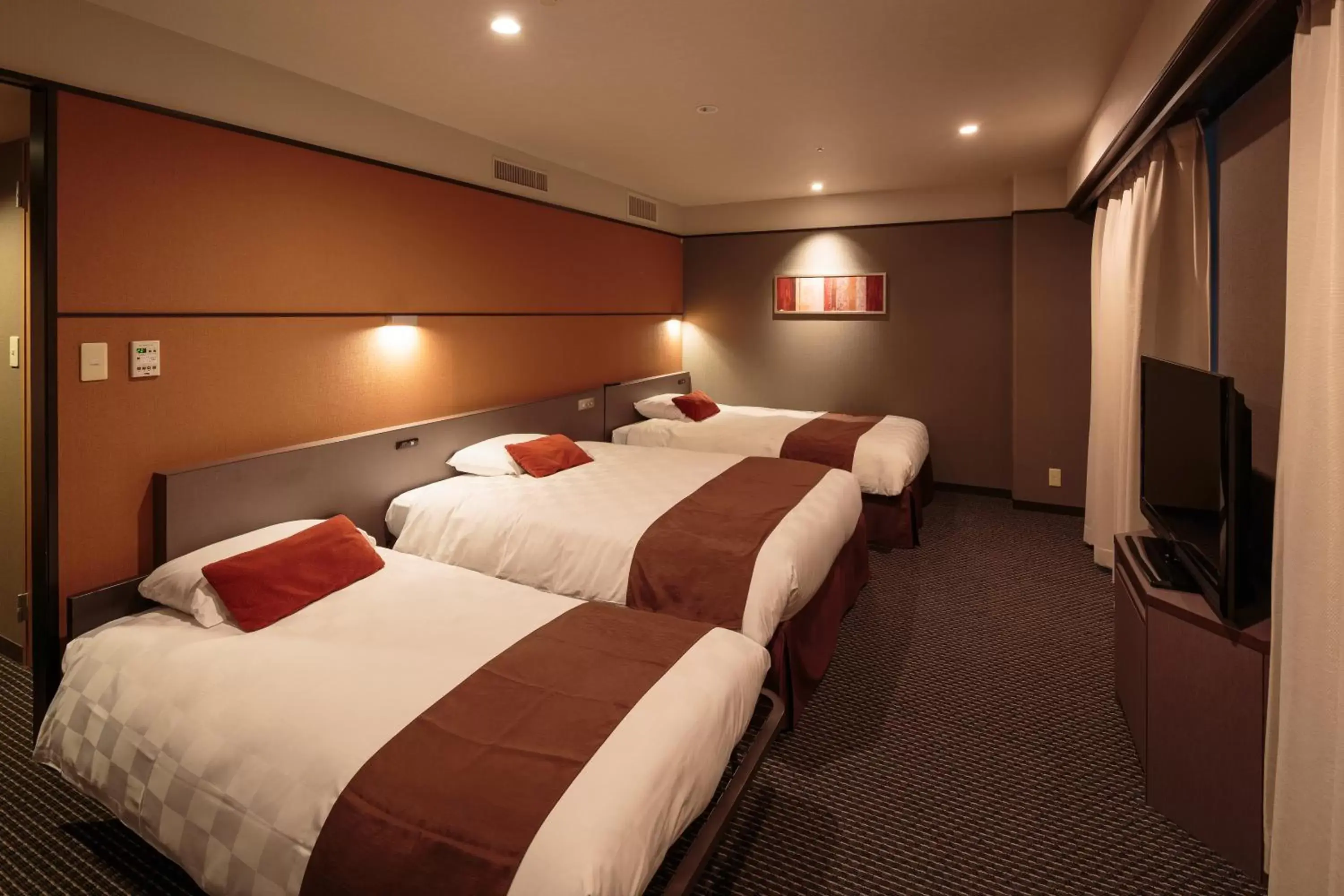 Bed in Matsuyama Tokyu REI Hotel