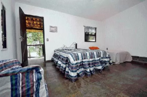 Bed in Pousada A Marca do Faraó