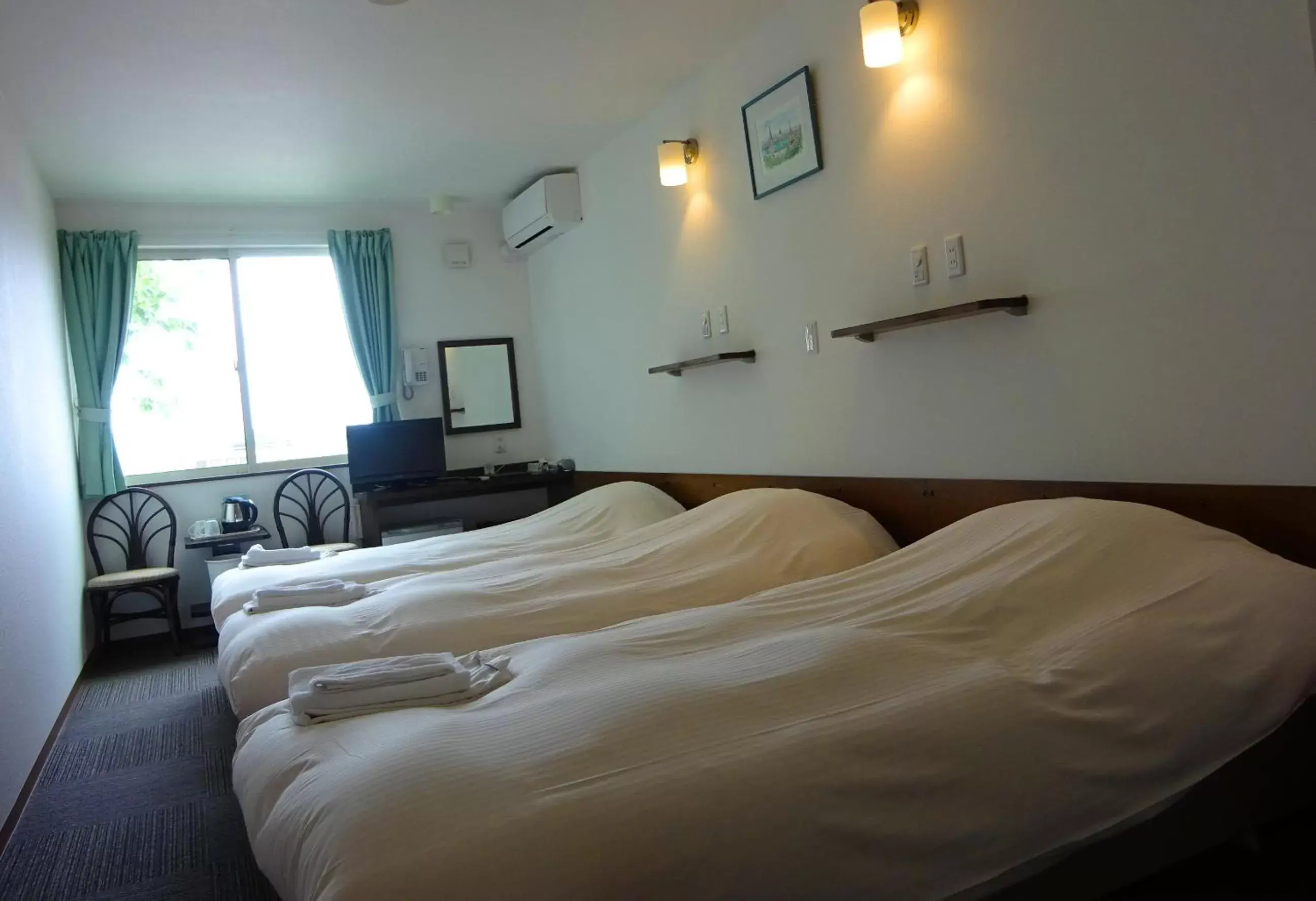 Bed in Hakodate Motomachi Hotel