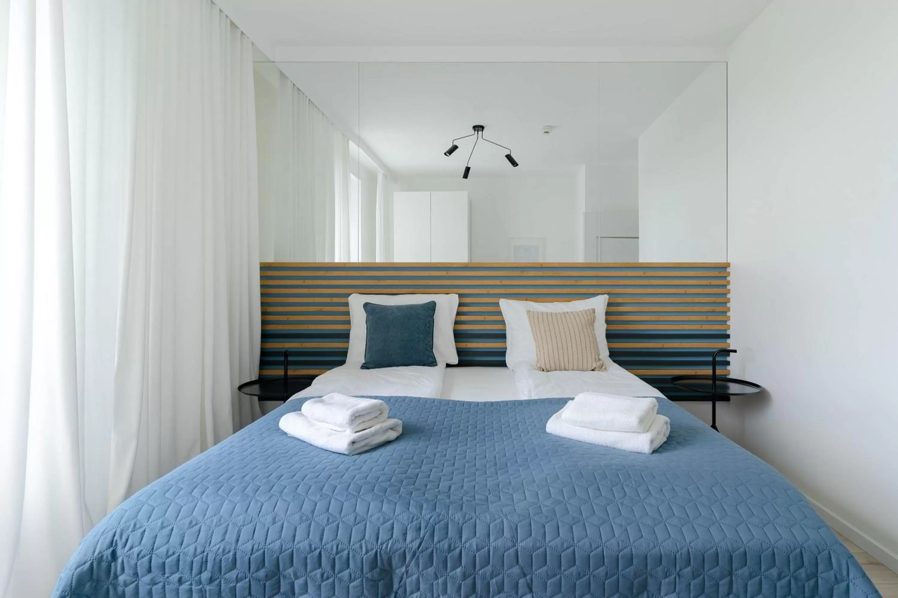 Bed in Symphony Modern Tower Apartamenty