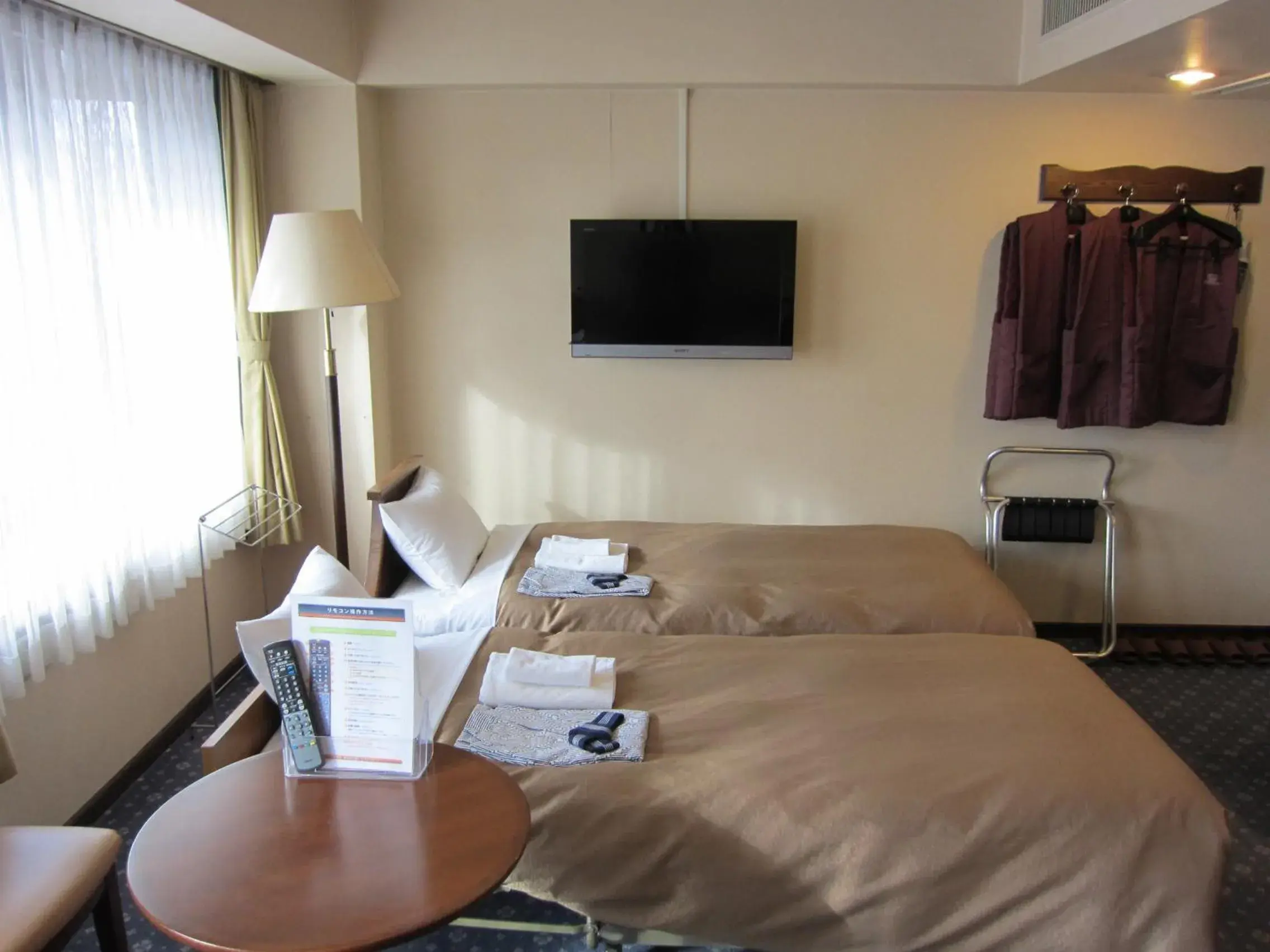 Photo of the whole room, TV/Entertainment Center in Hotel New Station