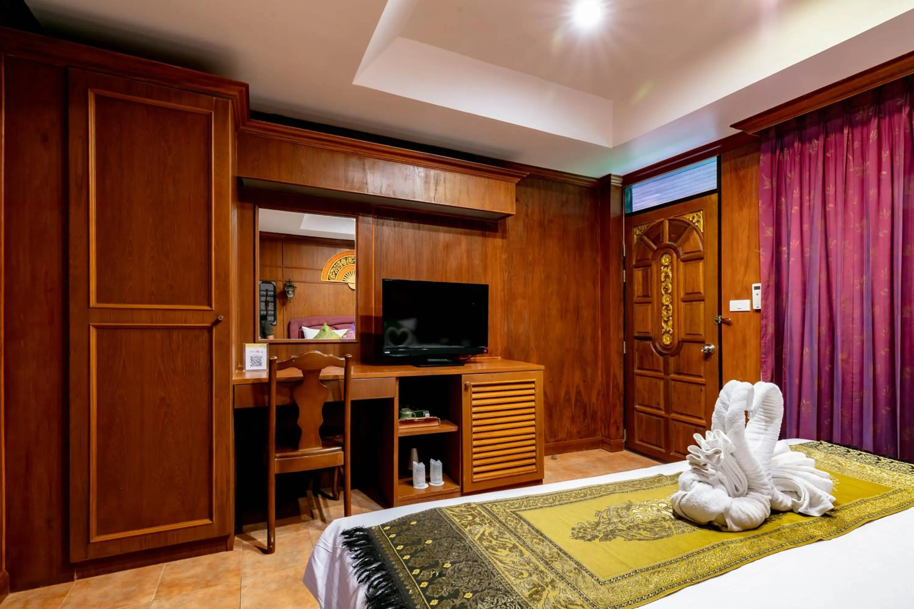 Photo of the whole room, Bed in Royal Phawadee Village Patong - 2 Minutes walk to the beach