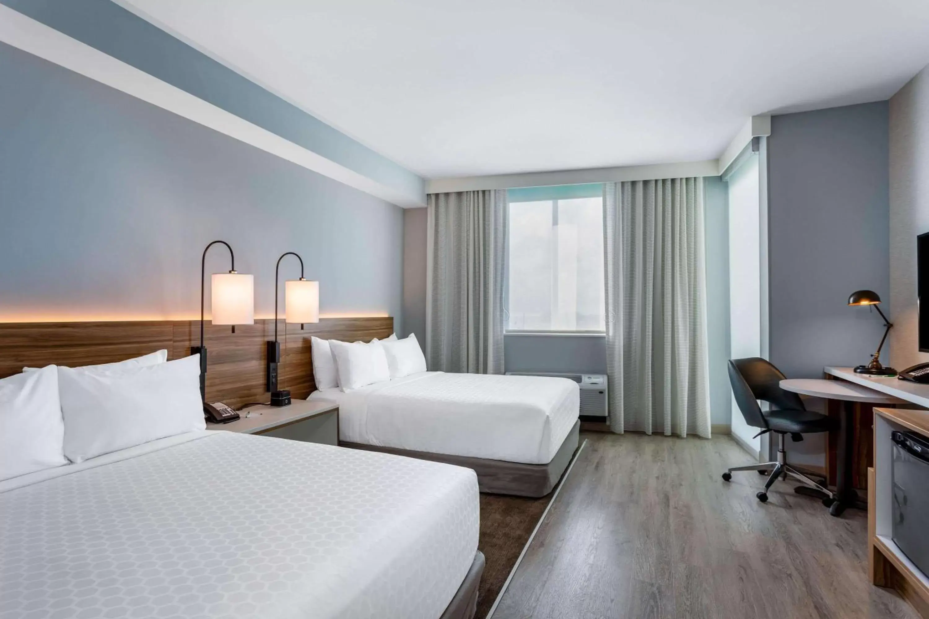 Photo of the whole room, Bed in Wyndham Garden Miami International Airport