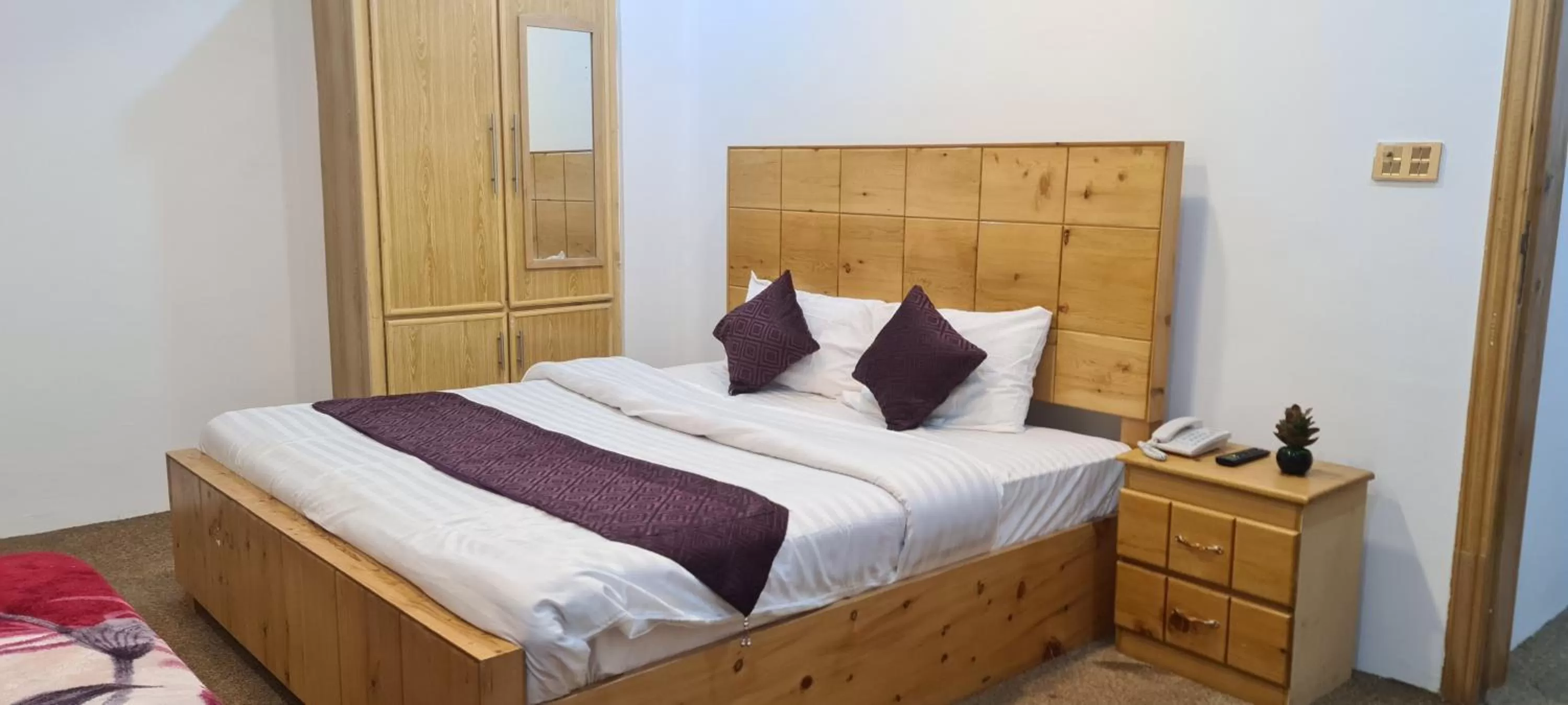 Bed in Indus Lodges Gilgit