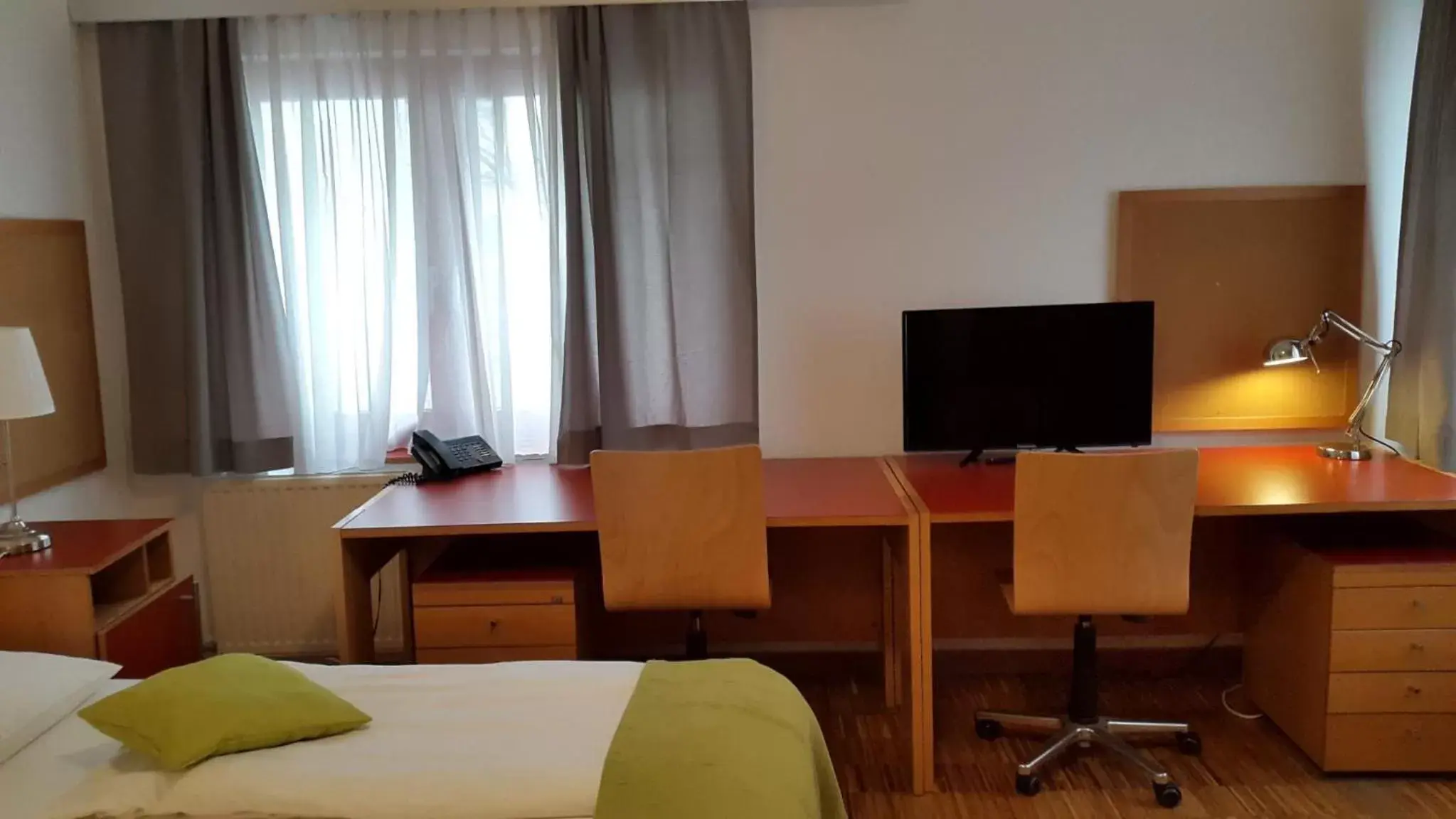 Photo of the whole room, TV/Entertainment Center in Hotel Korotan