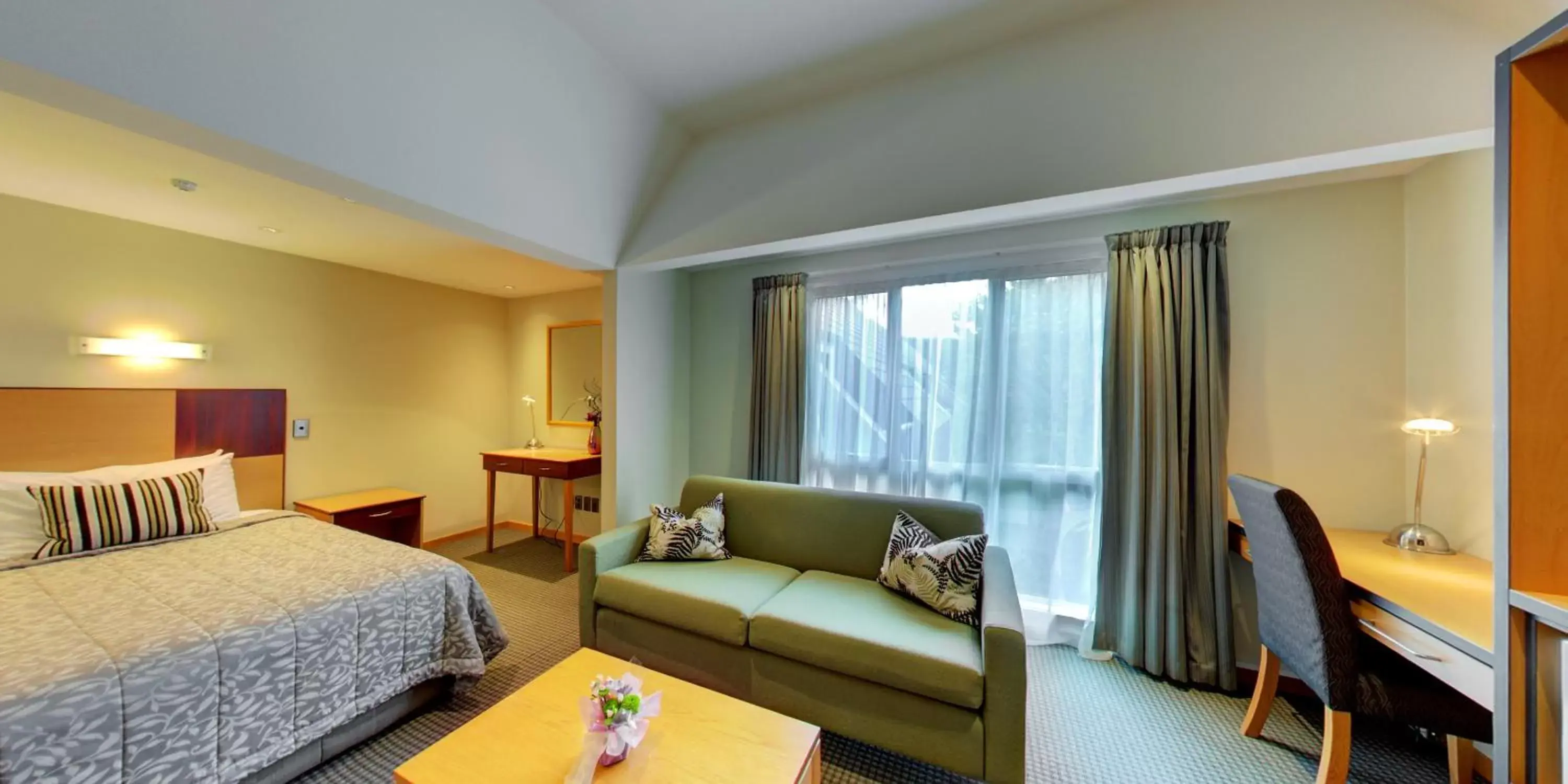 Bedroom in Dunedin Leisure Lodge - Distinction