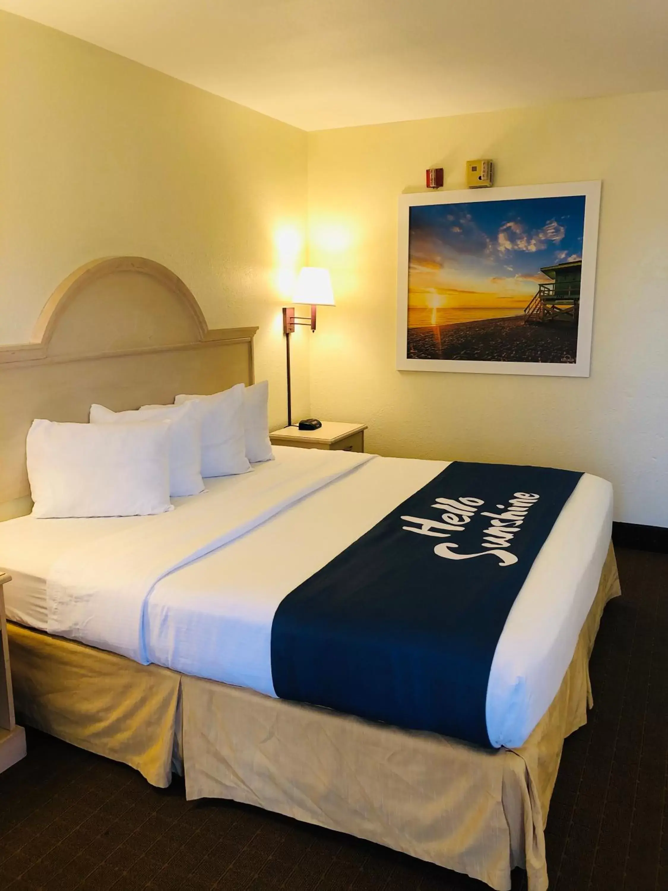 Bed in Days Inn & Suites by Wyndham Navarre Conference Center