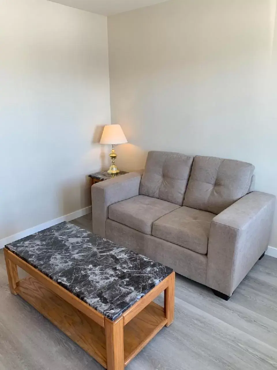 Bedroom, Seating Area in Red Deer Inn & Suites