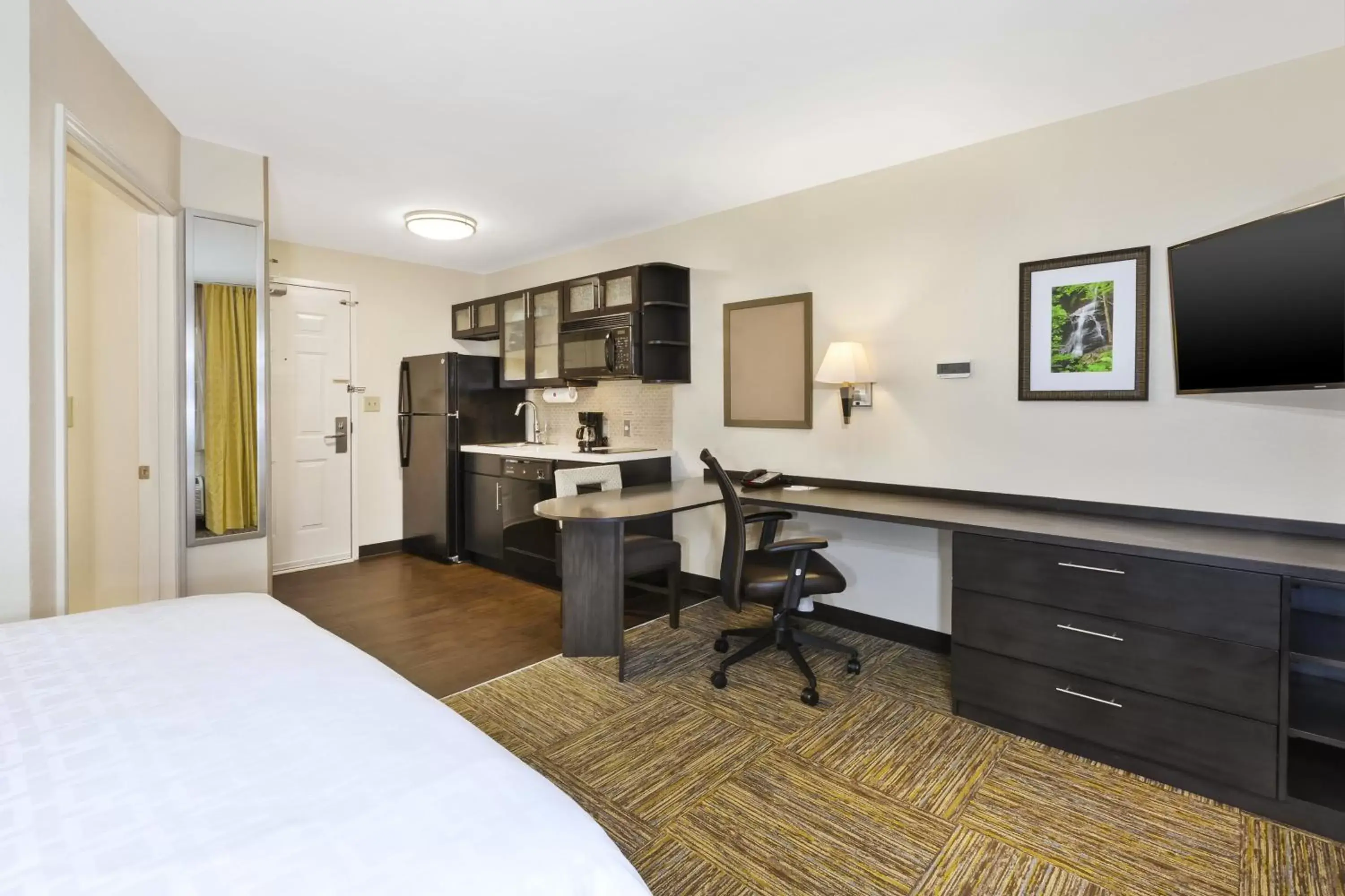 Photo of the whole room, TV/Entertainment Center in Candlewood Suites Huntersville-Lake Norman Area, an IHG Hotel