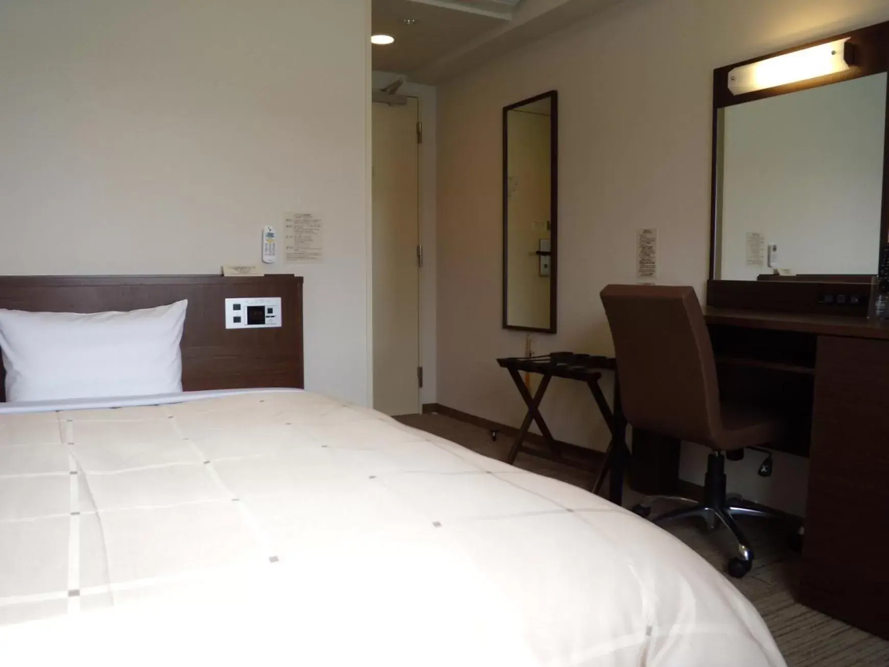 Bed in Hotel Route-Inn Tsuruoka Ekimae