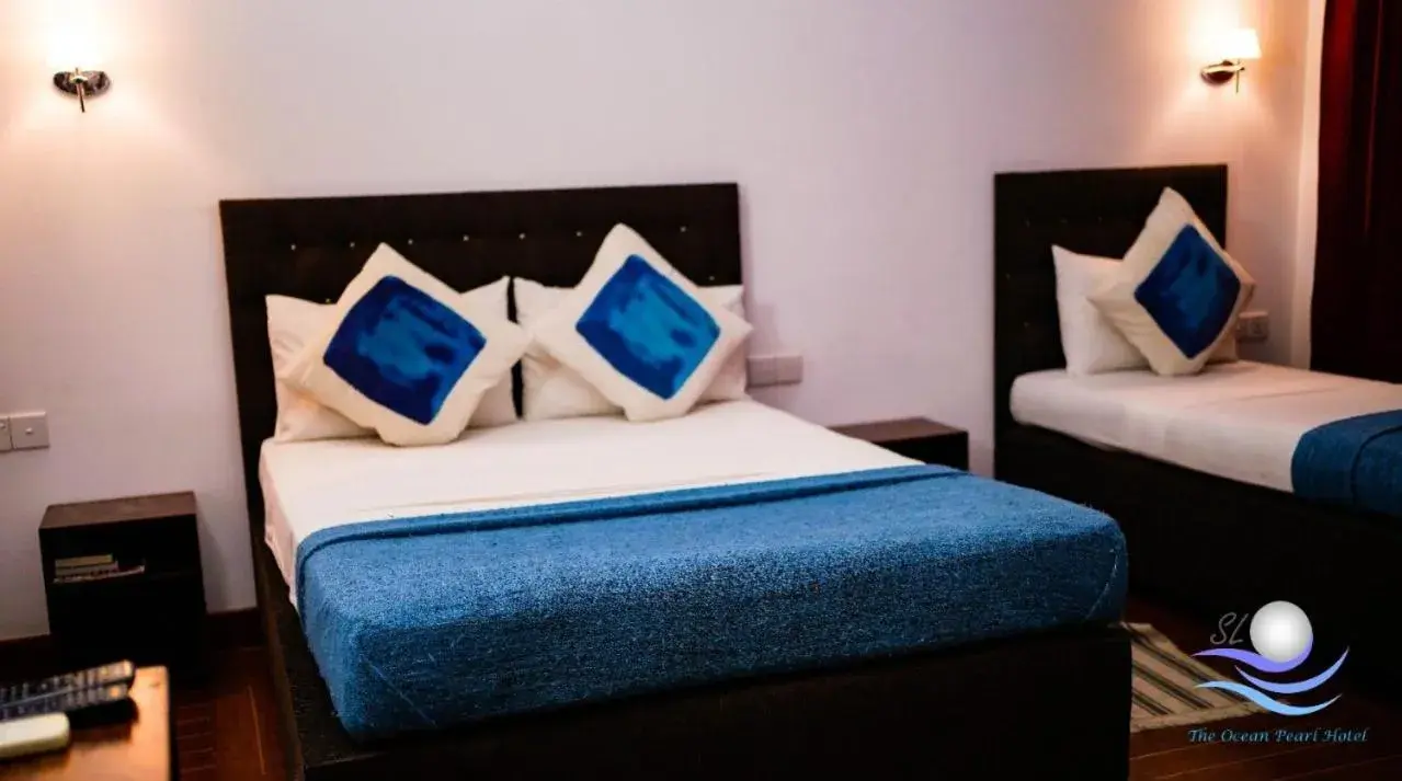Bed in The Ocean Pearl Hotel Negombo